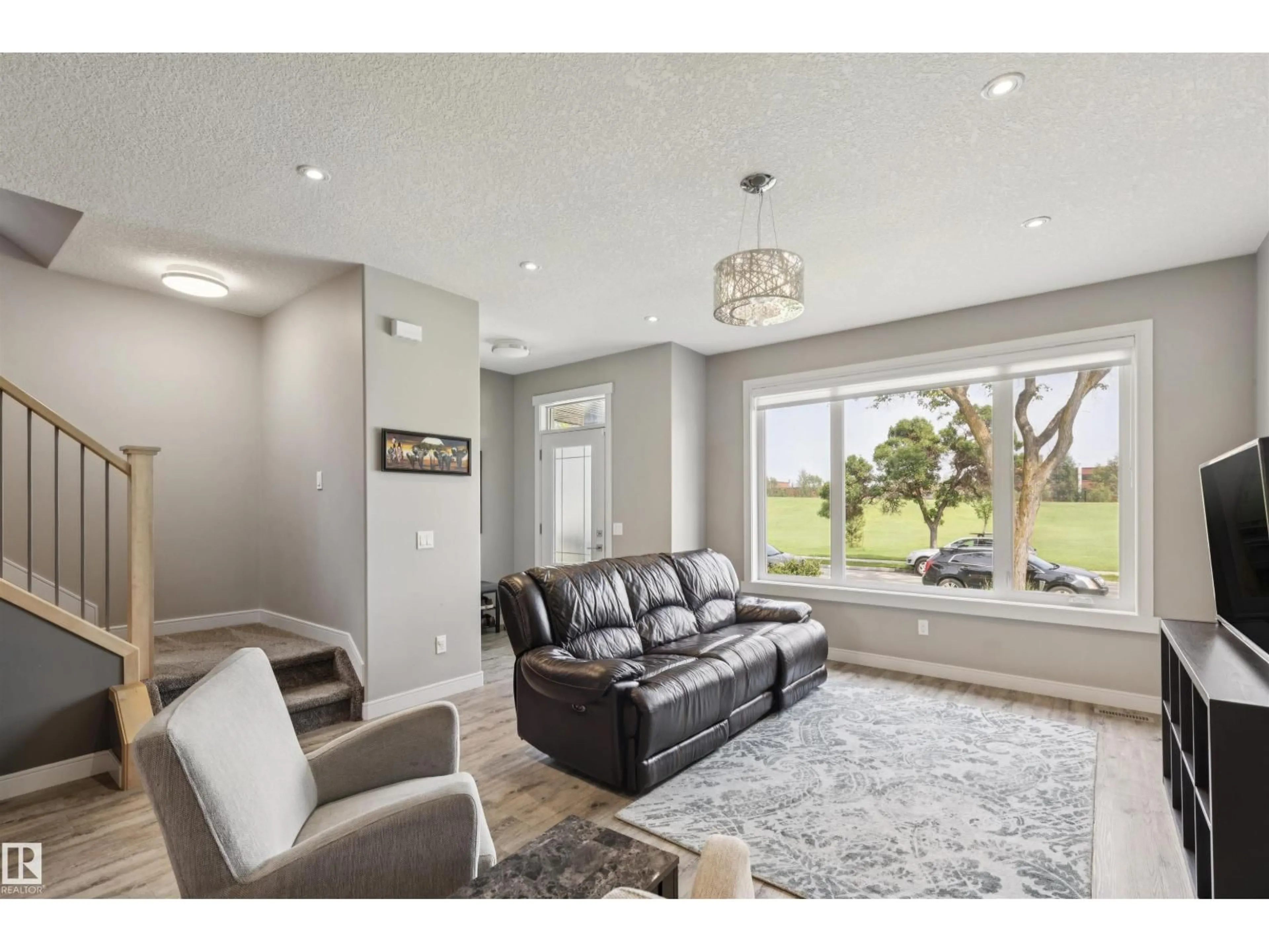 Living room with furniture, unknown for 11226 122 ST, Edmonton Alberta T5M0B7