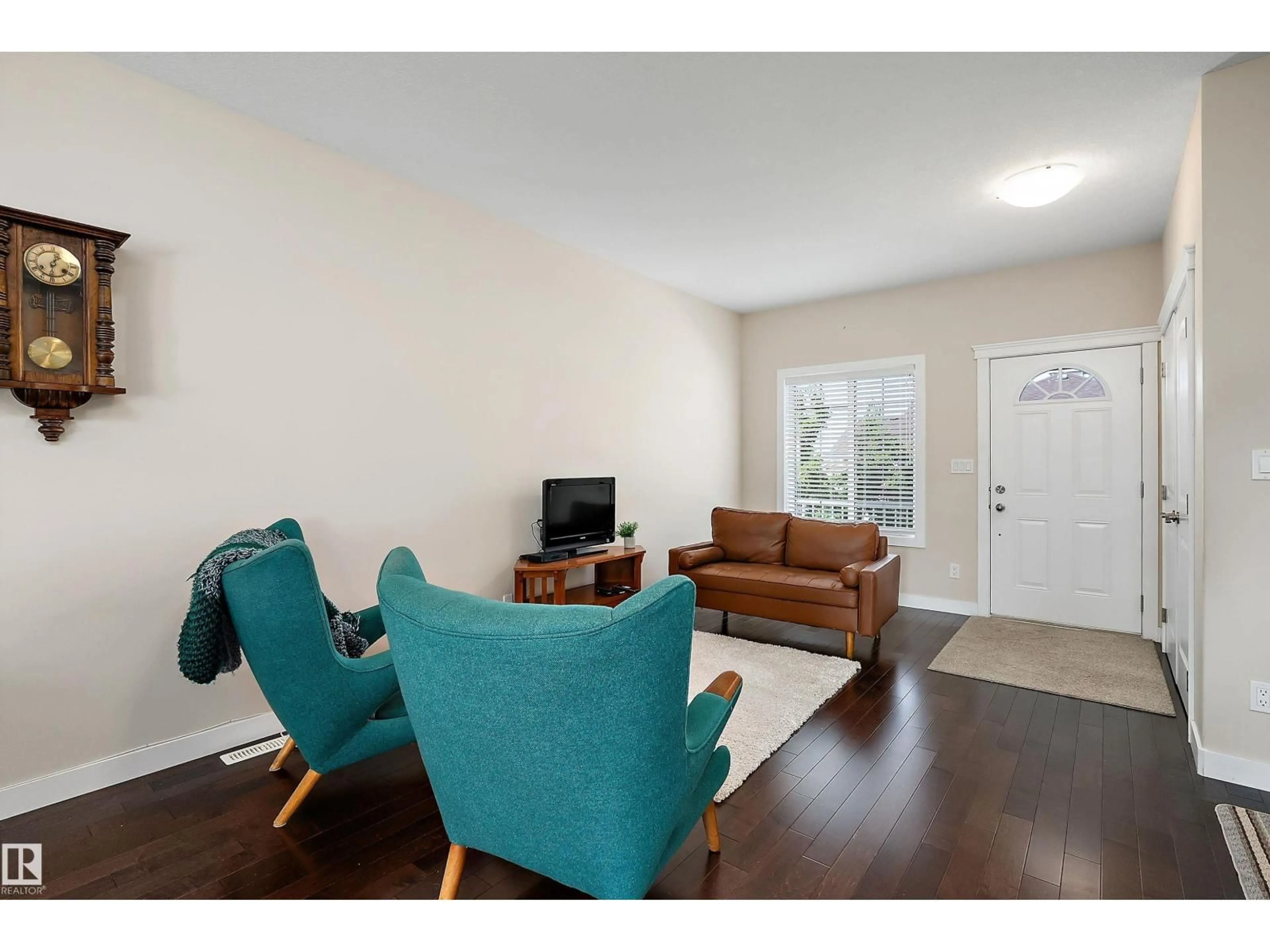Living room with furniture, wood/laminate floor for 39 - 401 BOTHWELL DR, Sherwood Park Alberta T8H2C9