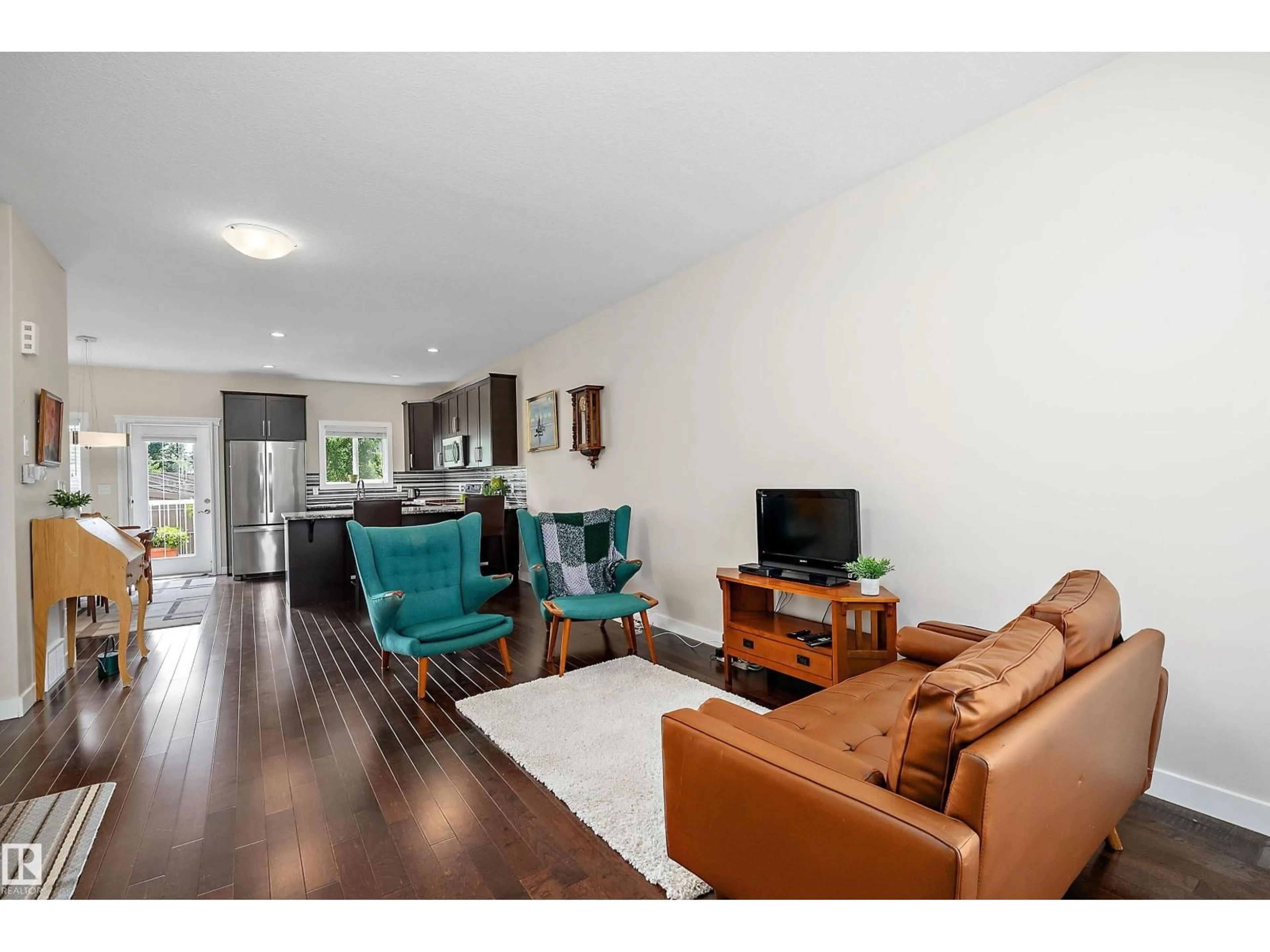 Living room with furniture, wood/laminate floor for 39 - 401 BOTHWELL DR, Sherwood Park Alberta T8H2C9