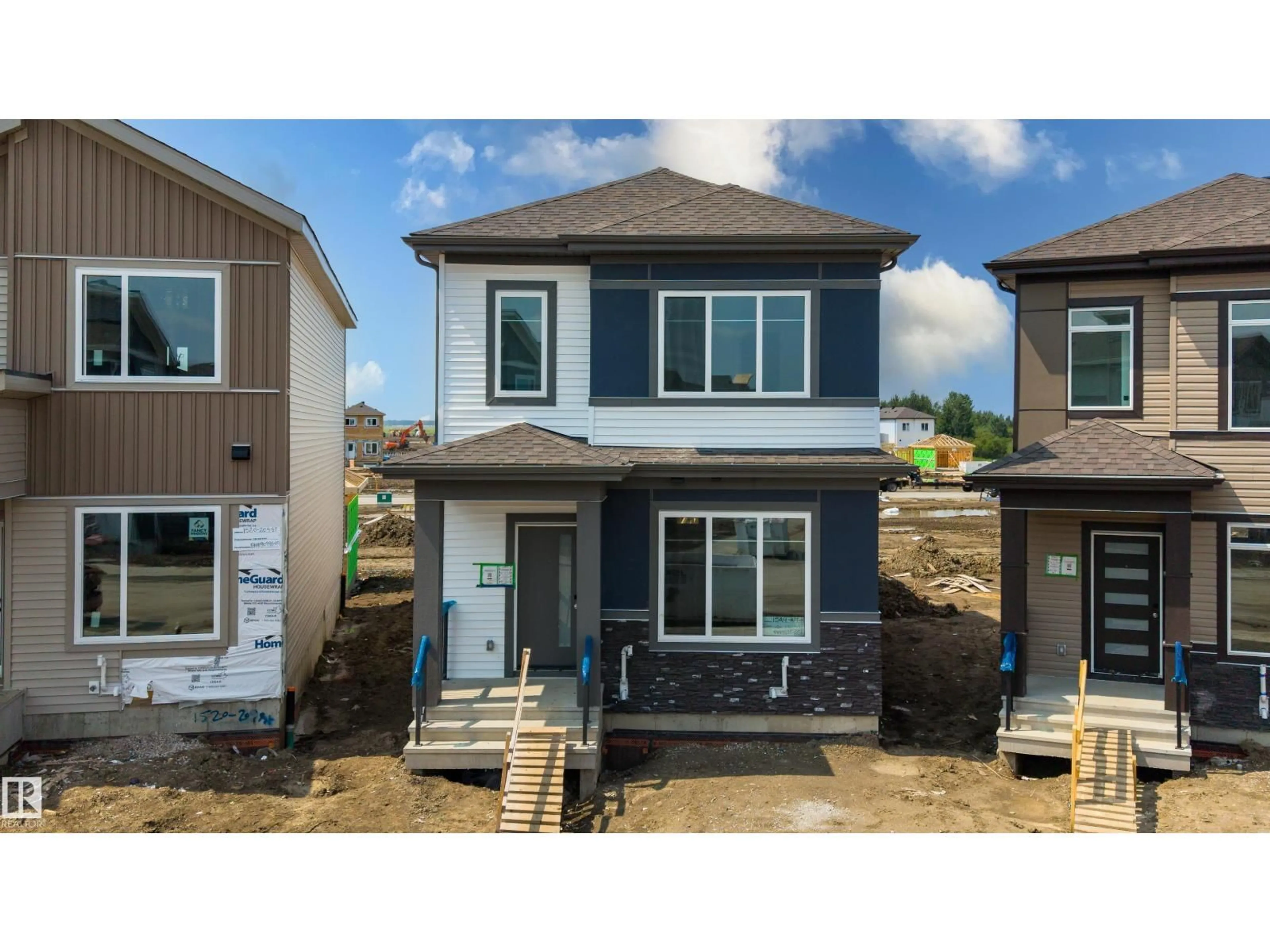 Home with vinyl exterior material, street for NW - 1524 209 ST, Edmonton Alberta T6M3N8