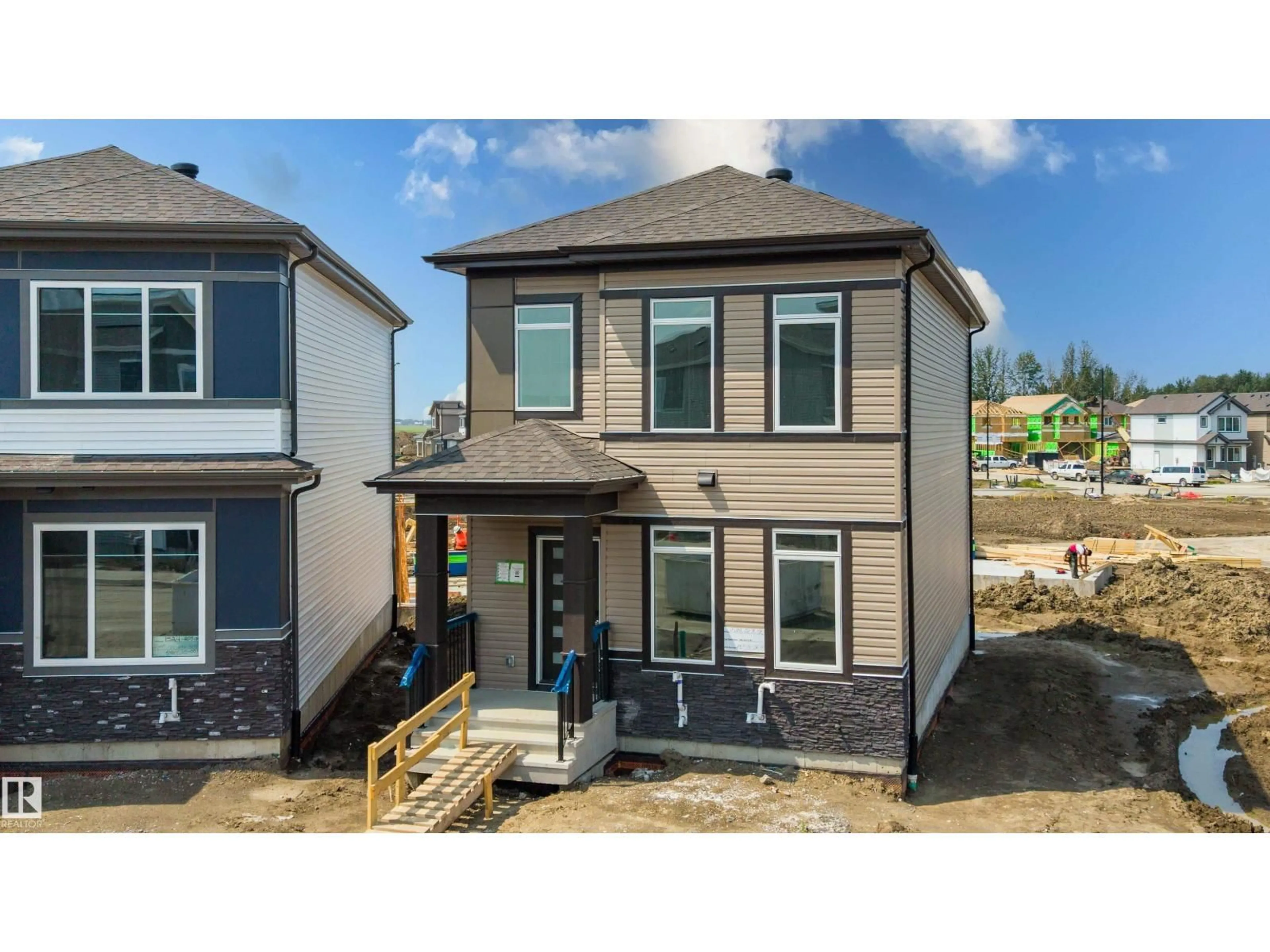 Home with vinyl exterior material, street for NW - 1528 209 ST, Edmonton Alberta T6M3N8