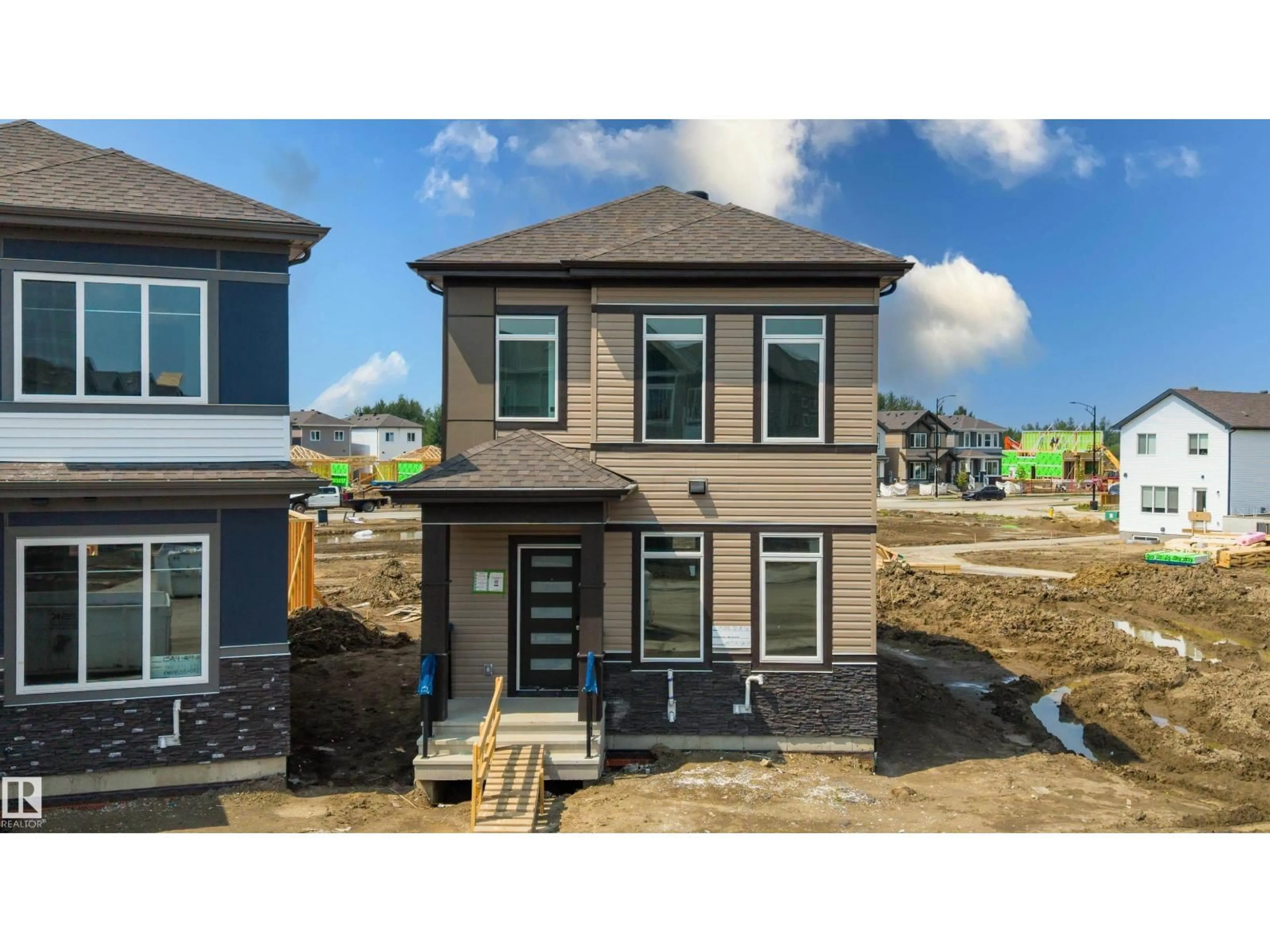 Home with brick exterior material, street for NW - 1528 209 ST, Edmonton Alberta T6M3N8