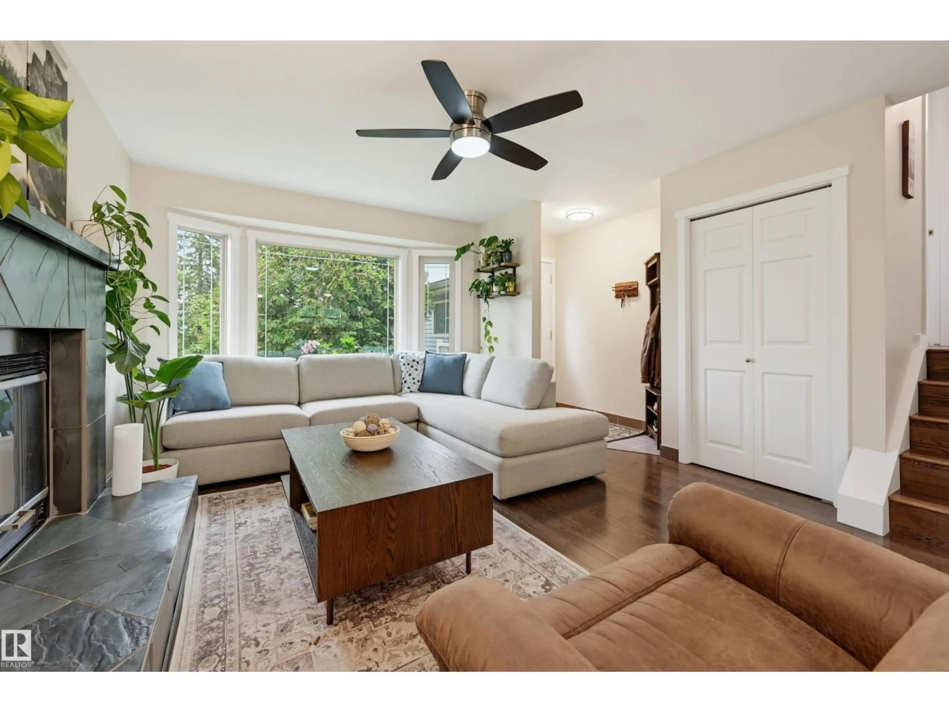 Living room with furniture, wood/laminate floor for NW - 8316 189A ST, Edmonton Alberta T5T4Z6