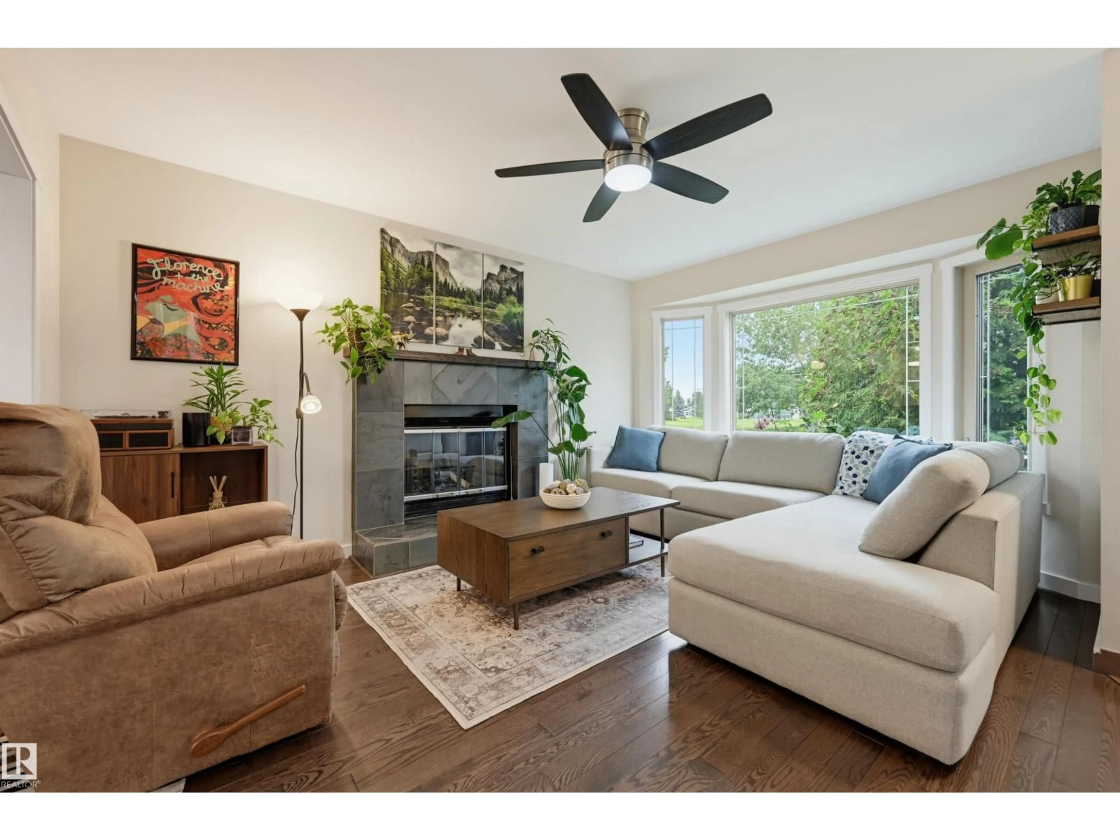 Living room with furniture, wood/laminate floor for NW - 8316 189A ST, Edmonton Alberta T5T4Z6