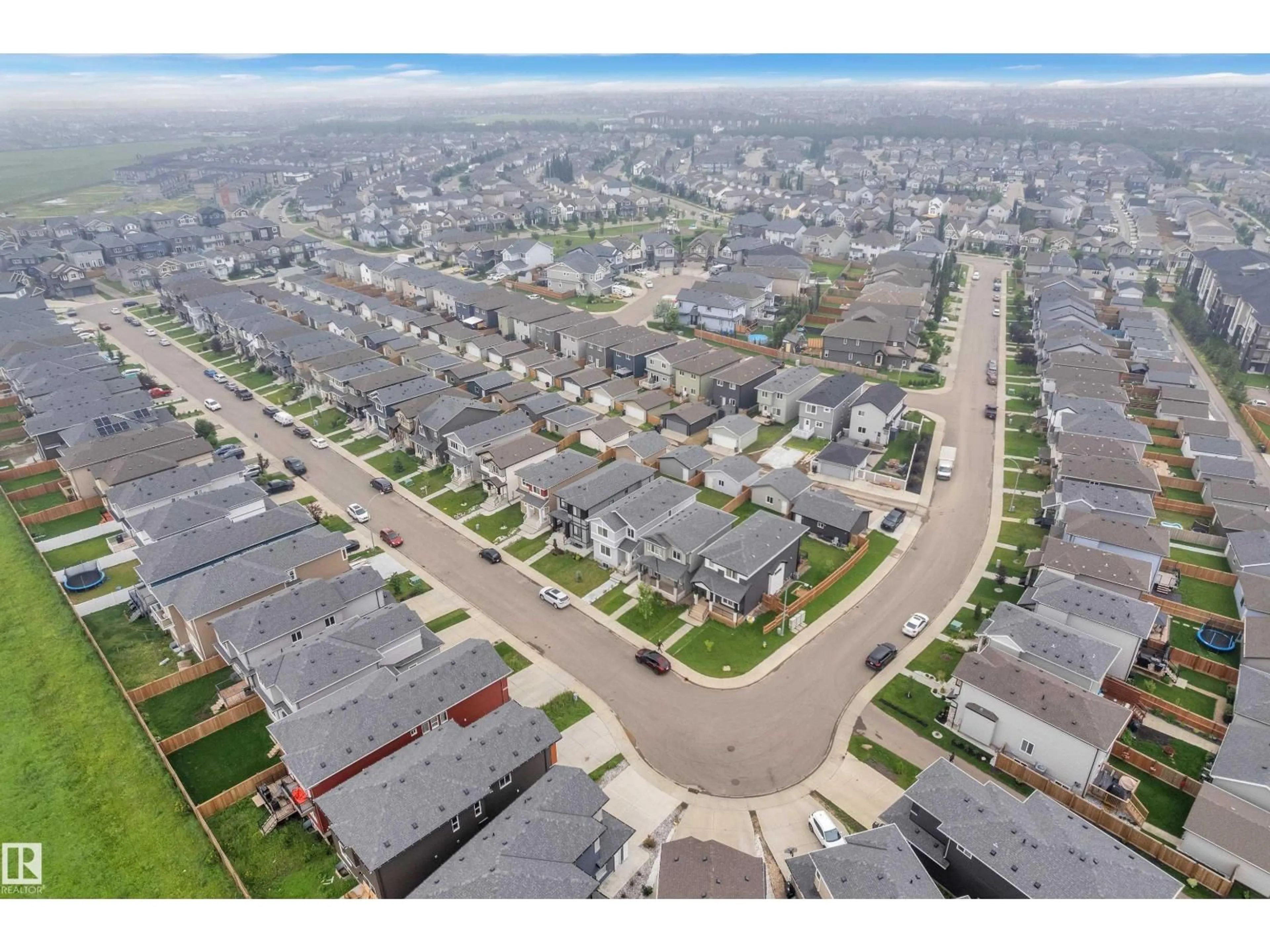 A pic from outside/outdoor area/front of a property/back of a property/a pic from drone, street for NW - 6099 180 AV, Edmonton Alberta T5Y3X1