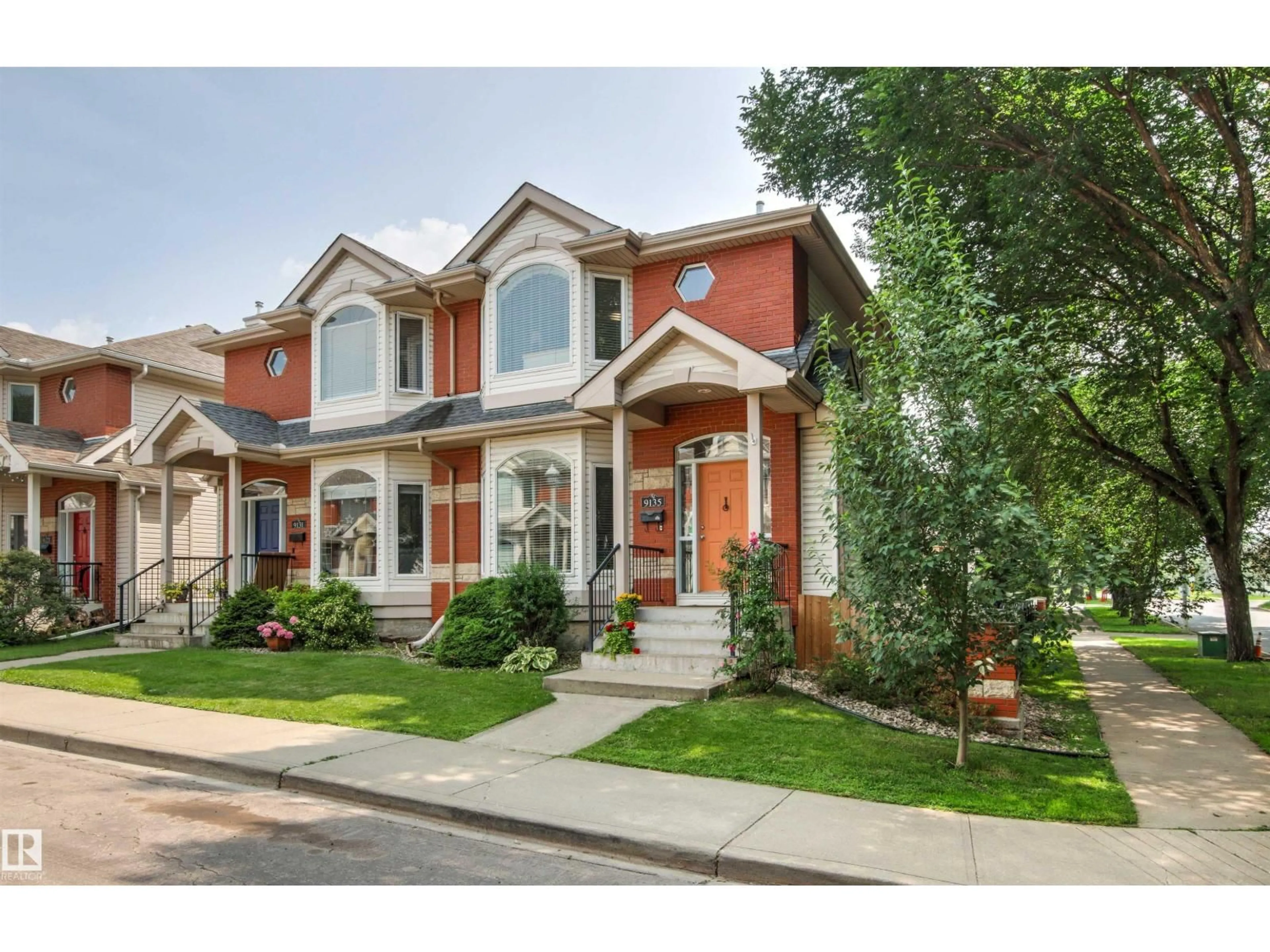 Home with brick exterior material, street for NW - 9135 100B AV, Edmonton Alberta T5H4N6