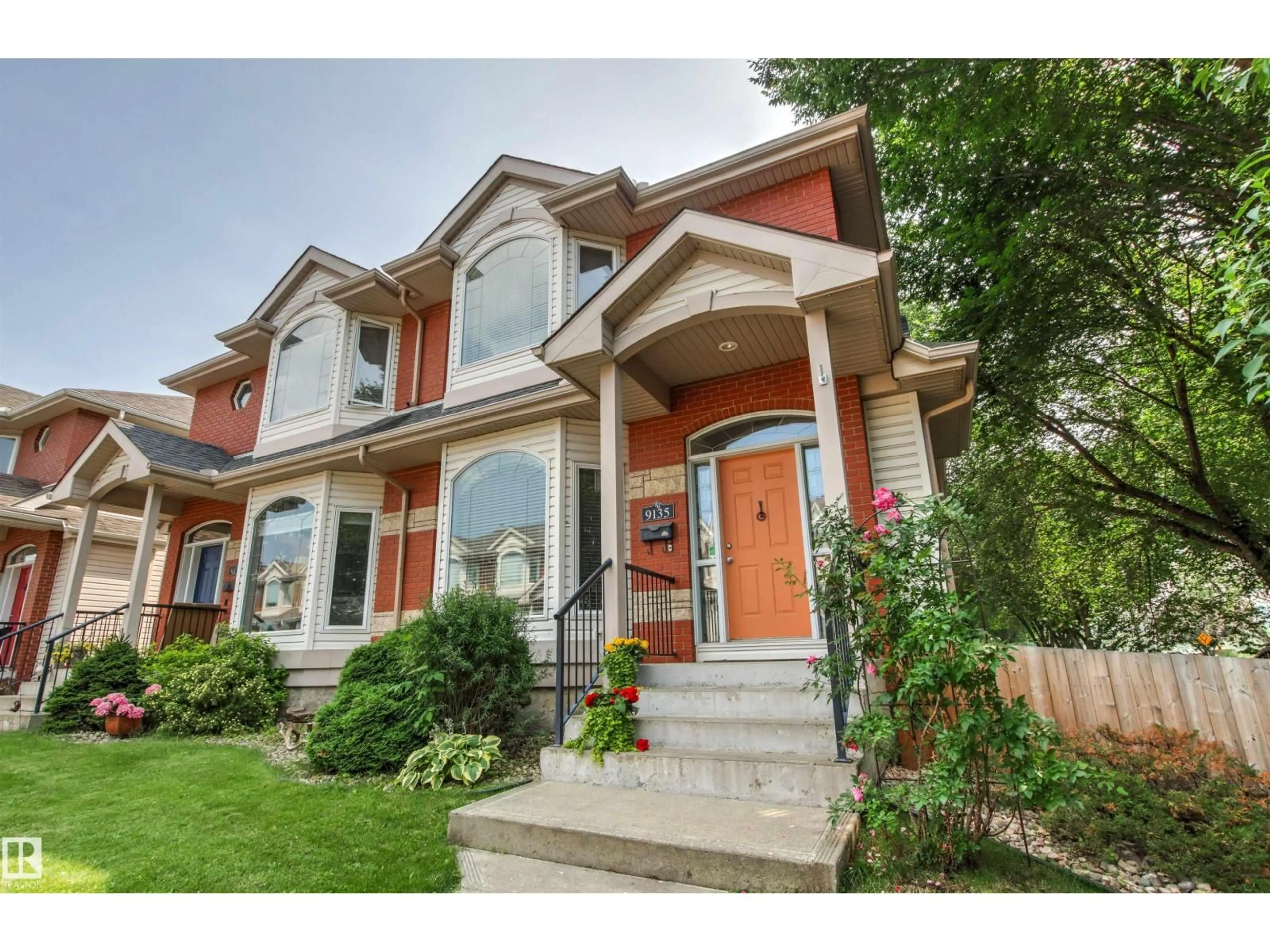 Home with brick exterior material, street for NW - 9135 100B AV, Edmonton Alberta T5H4N6