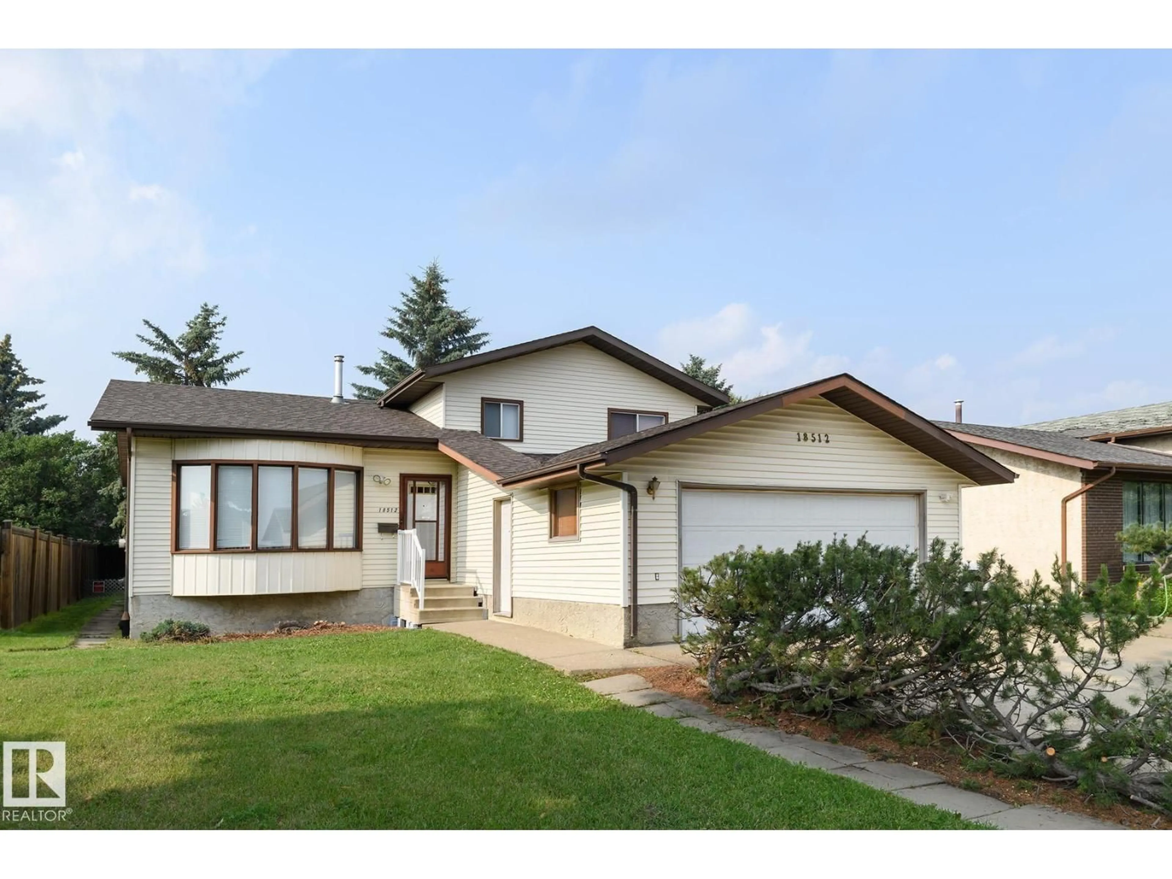 Home with vinyl exterior material, street for 18512 98 AV, Edmonton Alberta T5T3J5