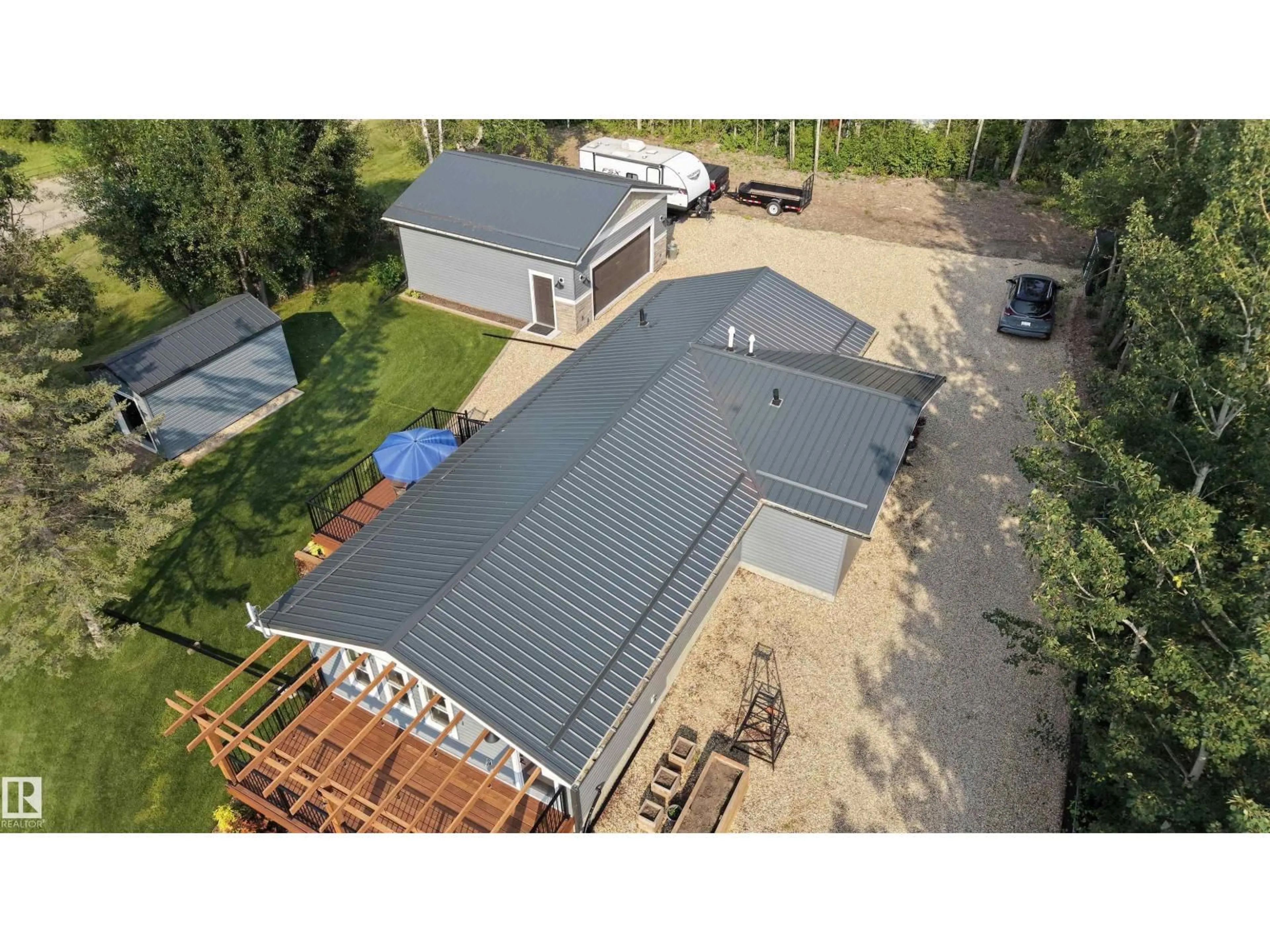 A pic from outside/outdoor area/front of a property/back of a property/a pic from drone, building for 701 - 55107 RGE ROAD 33, Rural Lac Ste. Anne County Alberta T0E0A0