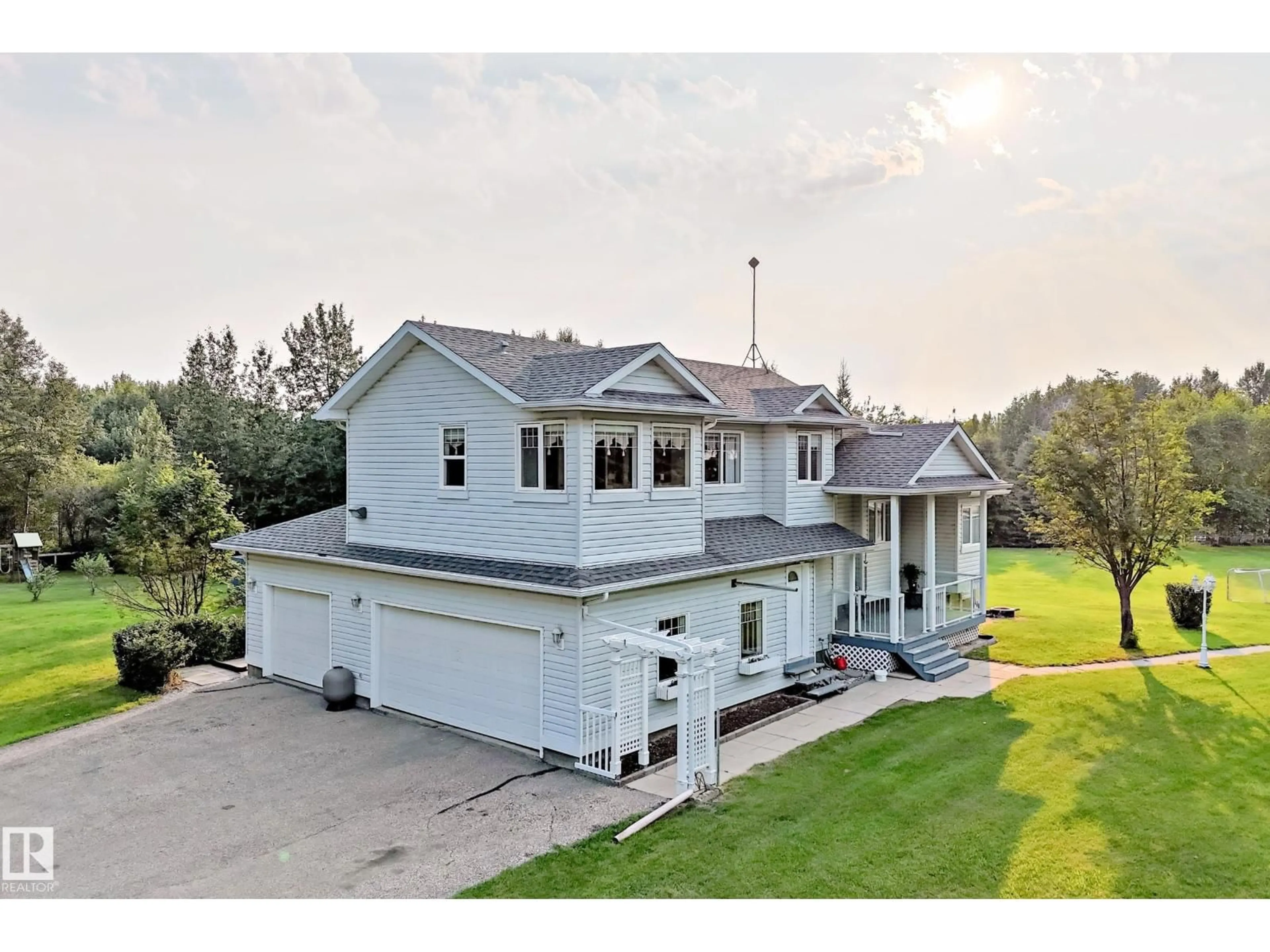 A pic from outside/outdoor area/front of a property/back of a property/a pic from drone, unknown for 8 - 26321 HGHWAY, Rural Parkland County Alberta T7Y1C7