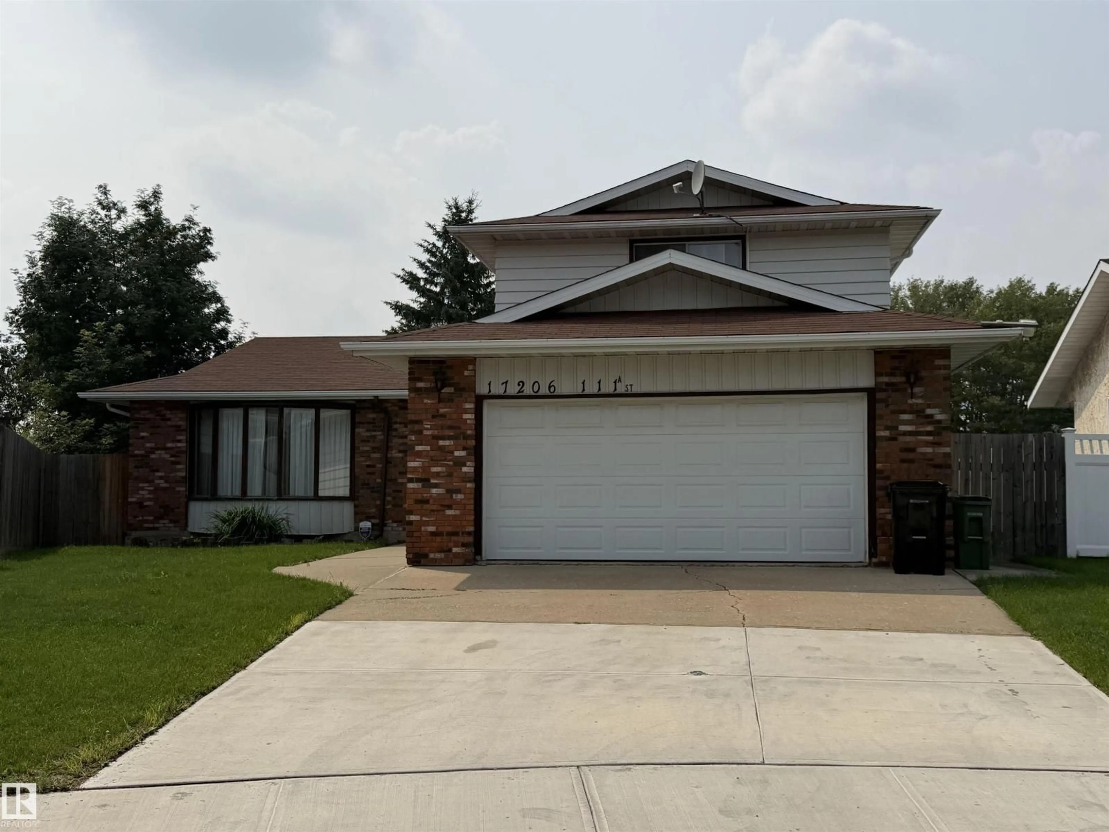 Home with vinyl exterior material, street for NW - 17206 111A ST, Edmonton Alberta T5X3K2