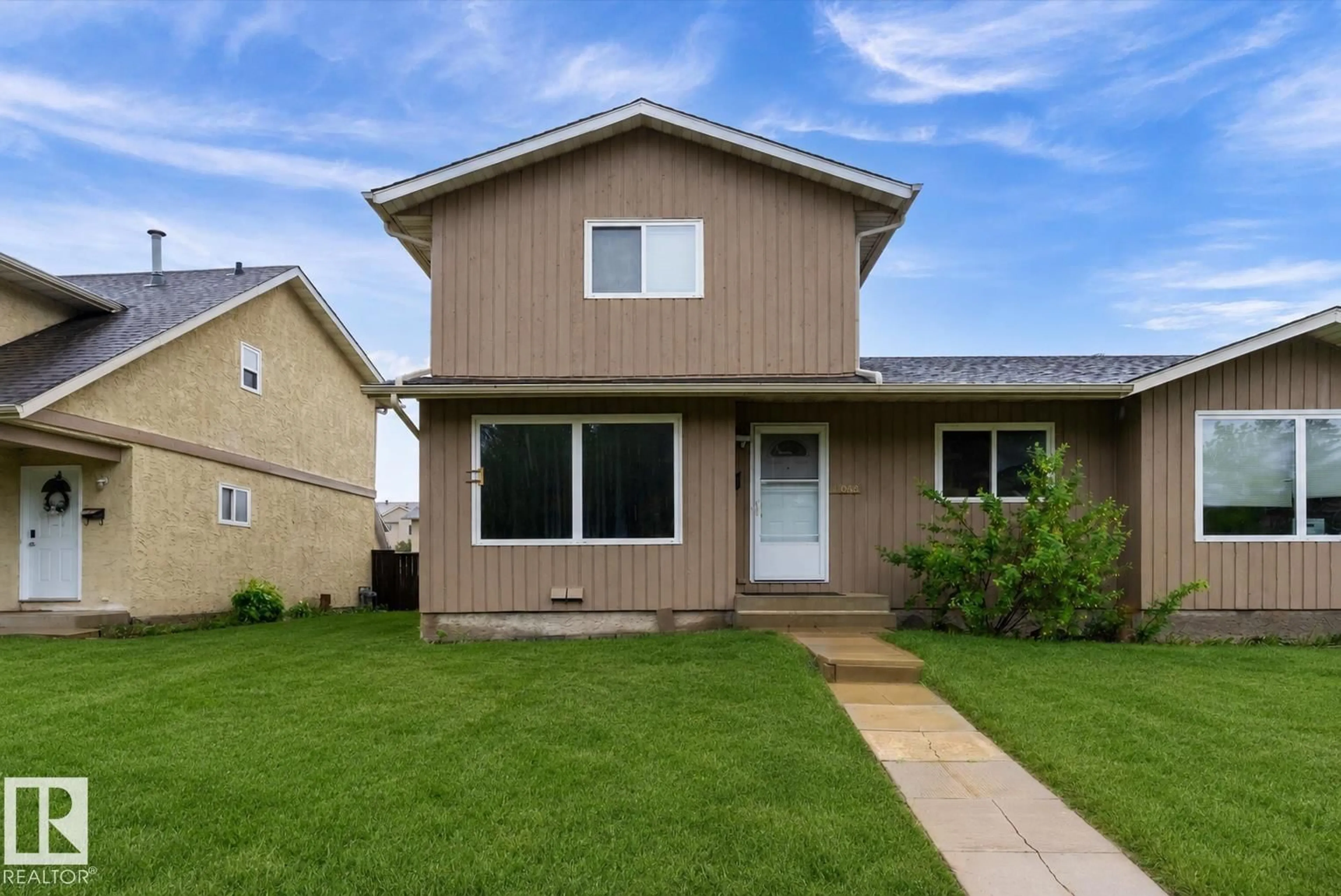 Home with vinyl exterior material, street for 18045 96 AV, Edmonton Alberta T5T2Z3
