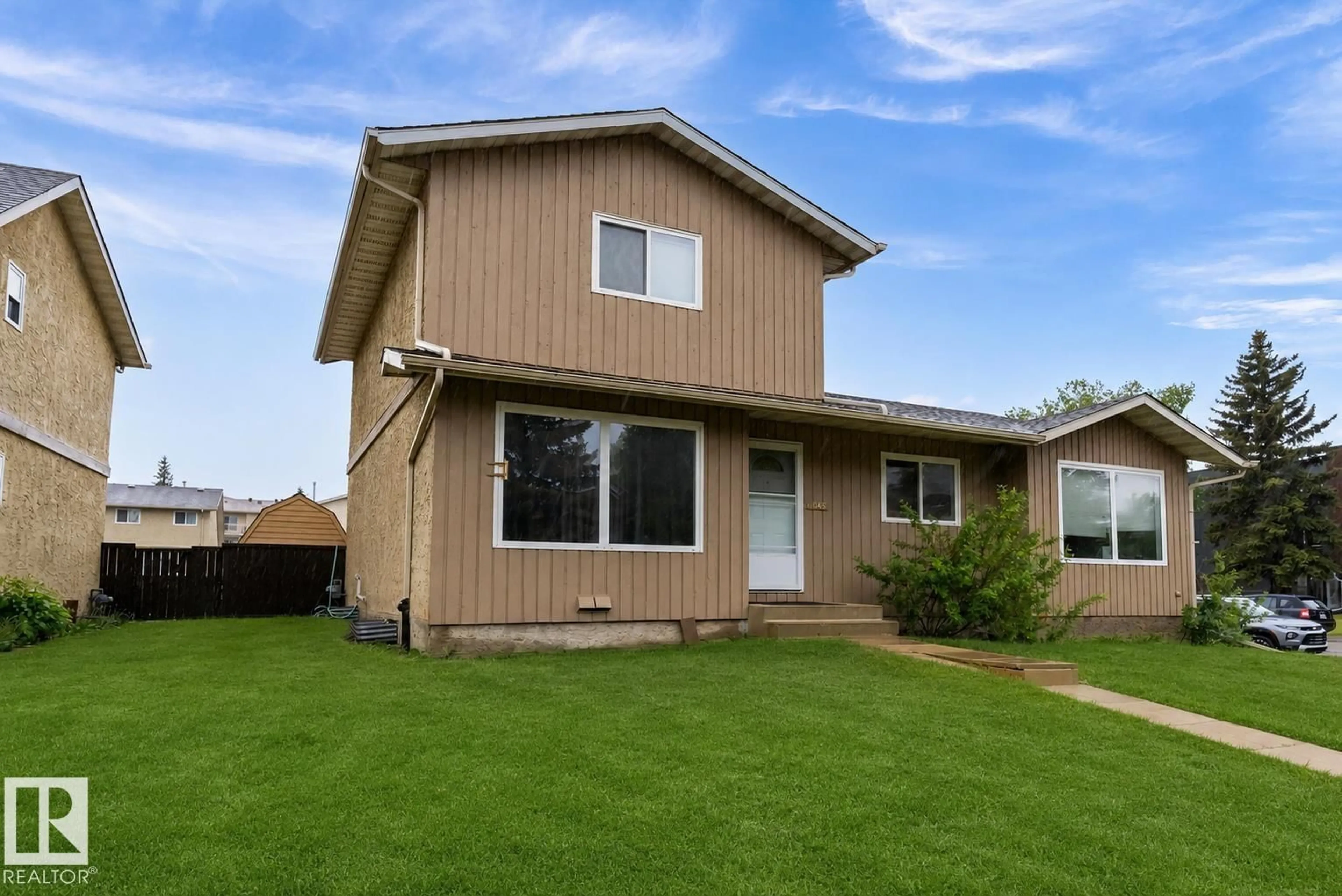 Home with vinyl exterior material, street for 18045 96 AV, Edmonton Alberta T5T2Z3