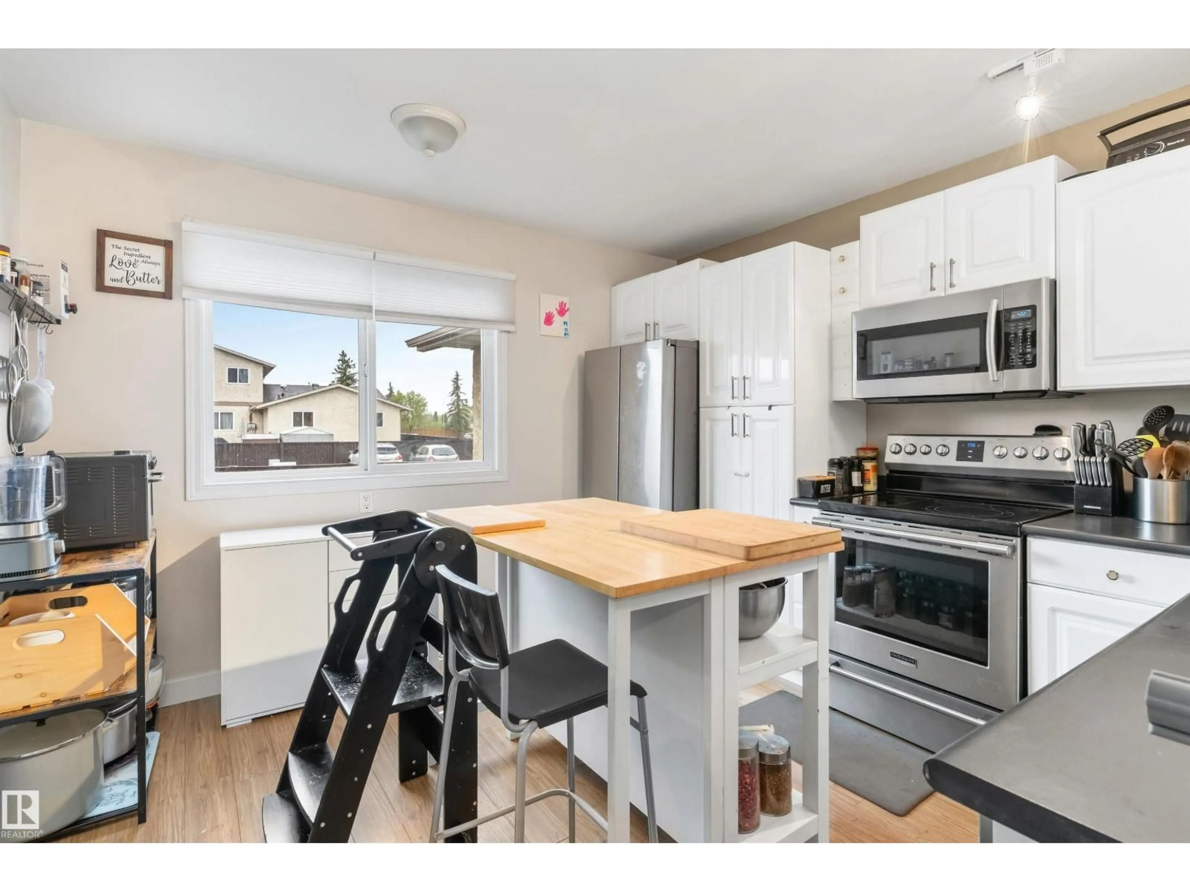 Open concept kitchen, wood/laminate floor for 18045 96 AV, Edmonton Alberta T5T2Z3