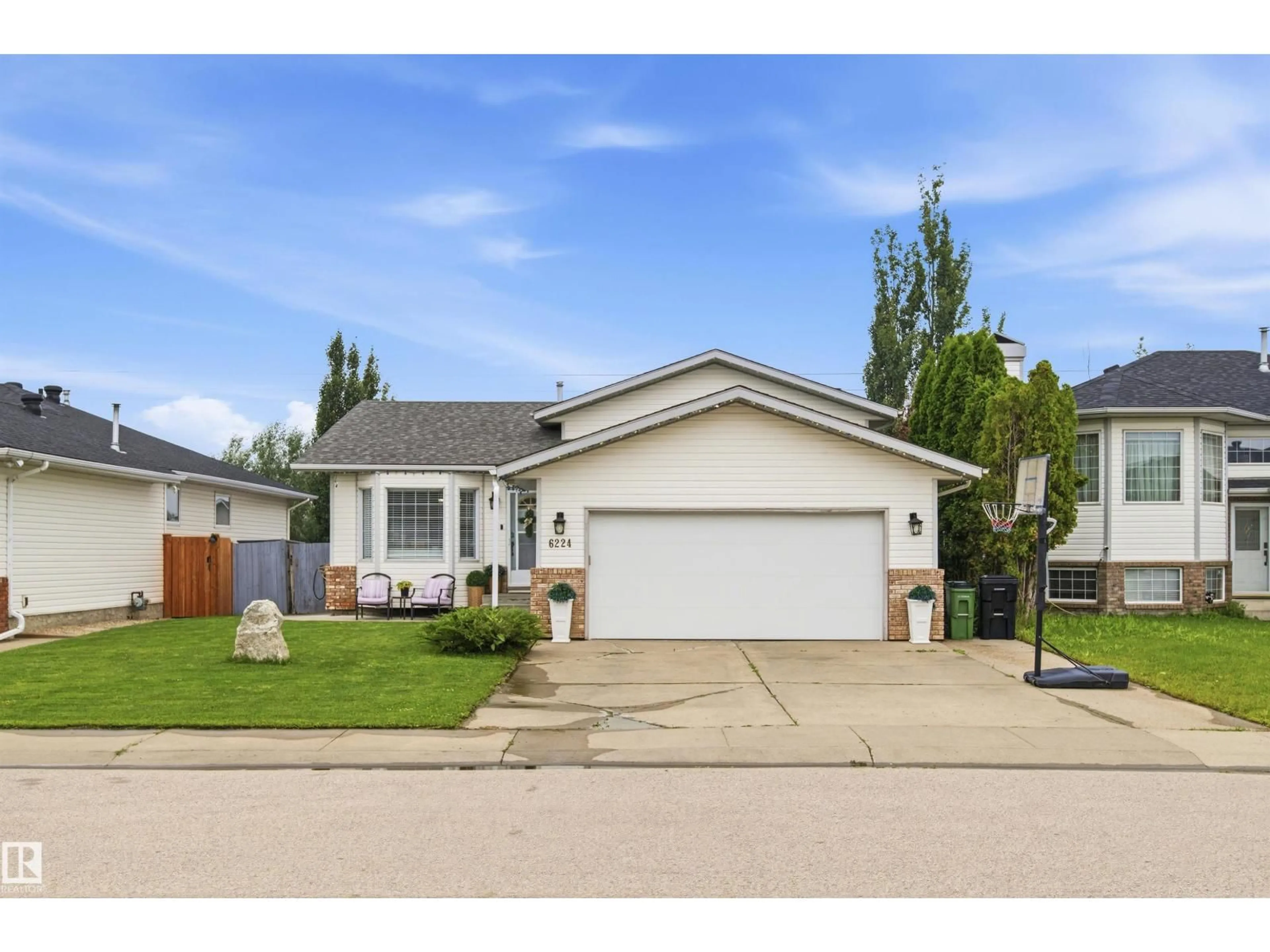 Home with vinyl exterior material, street for NW - 6224 162B AV, Edmonton Alberta T5Y2S1