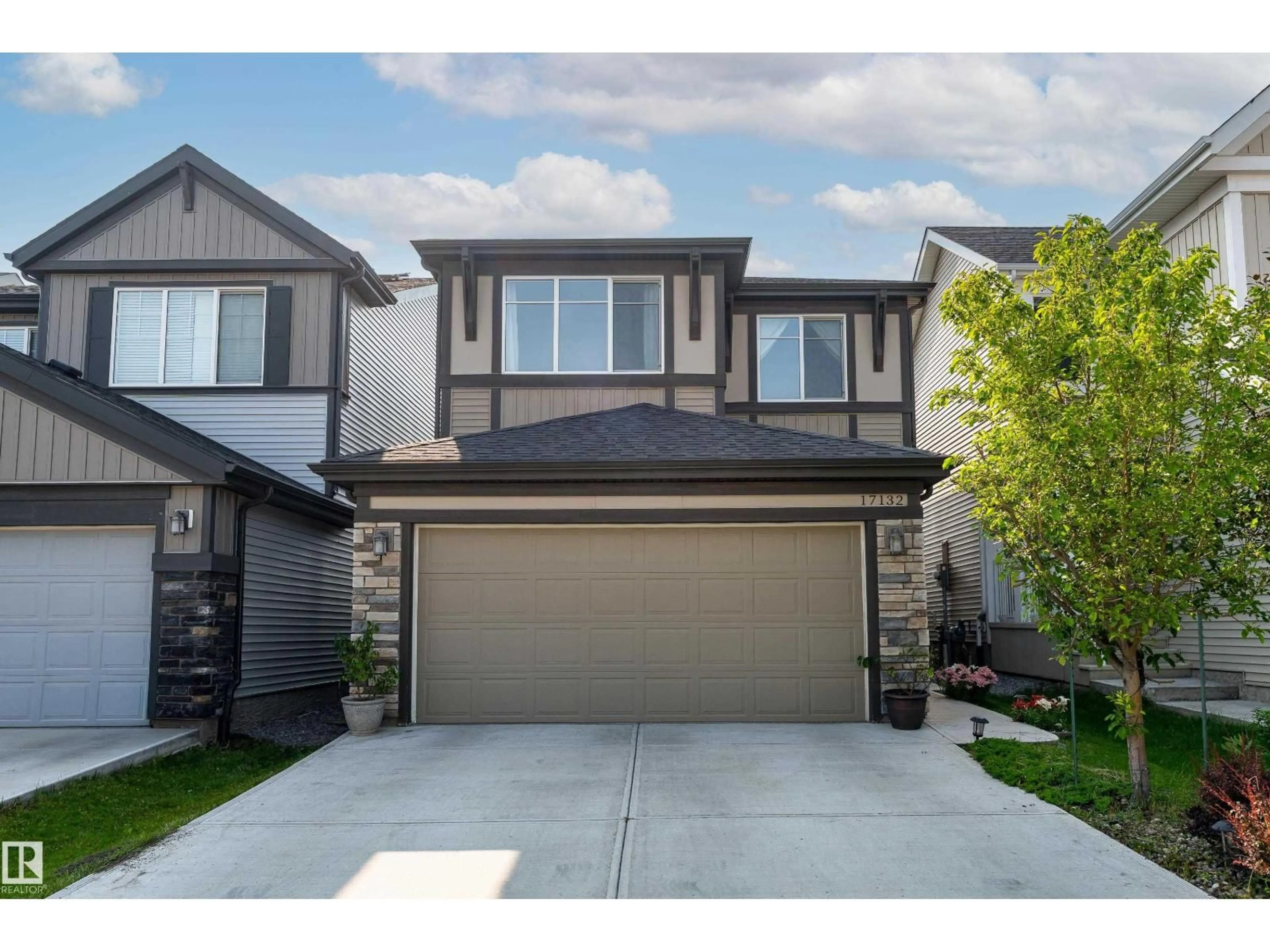 Home with vinyl exterior material, street for 17132 64 ST, Edmonton Alberta T5Y3T6