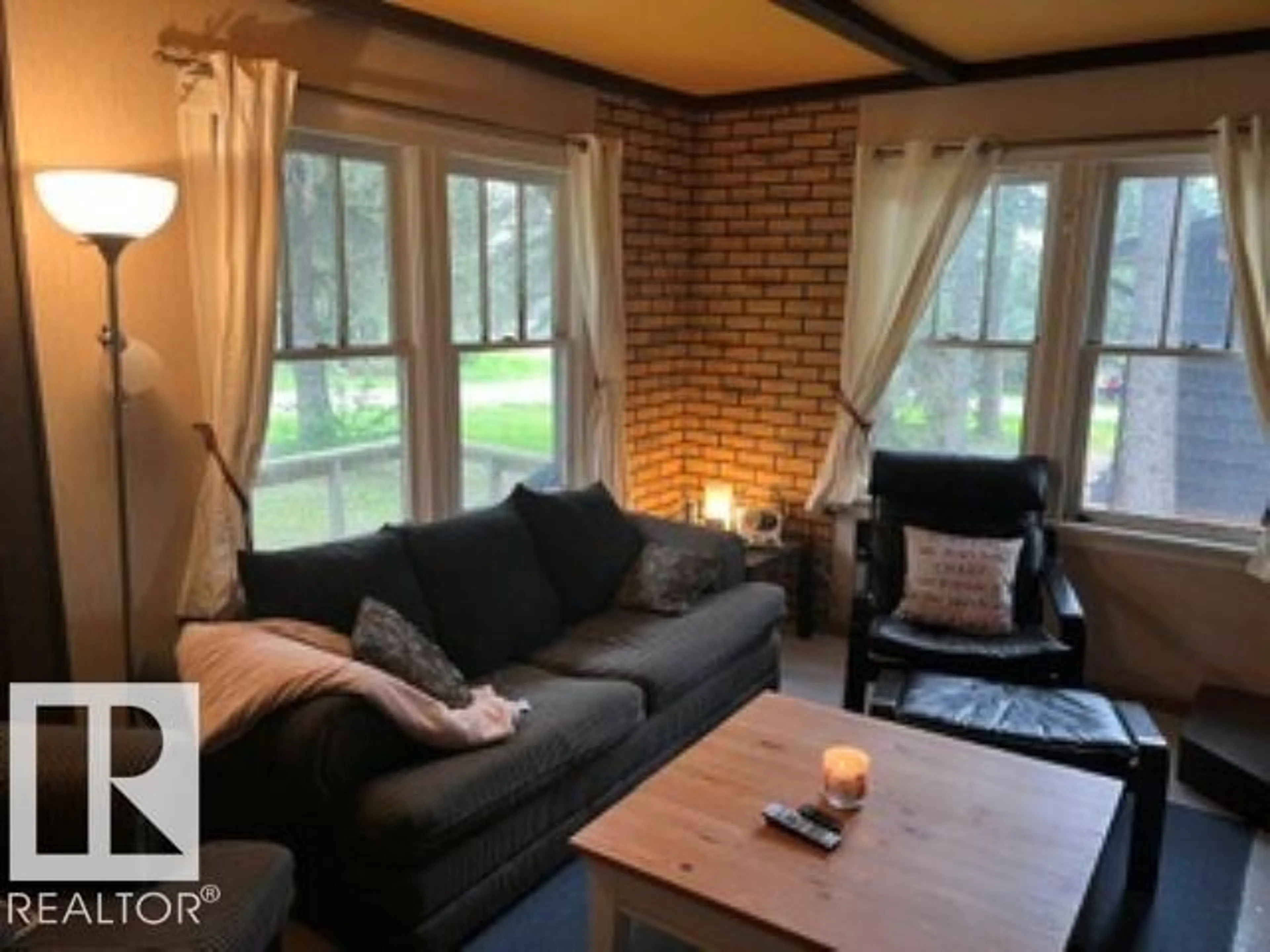 Living room with furniture, wood/laminate floor for 515 5TH ST, Rural Wetaskiwin County Alberta T0C2V0