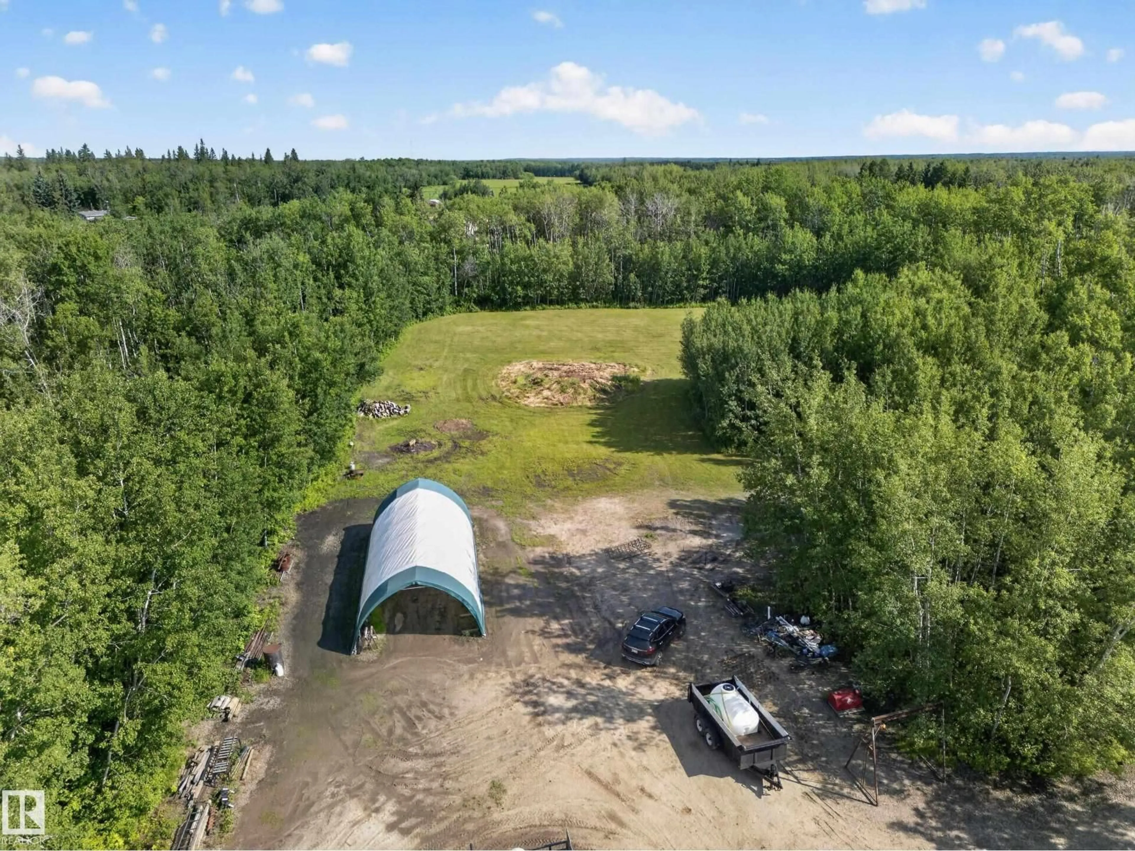 A pic from outside/outdoor area/front of a property/back of a property/a pic from drone, unknown for 22035 TWP ROAD 522, Rural Strathcona County Alberta T8E1J4