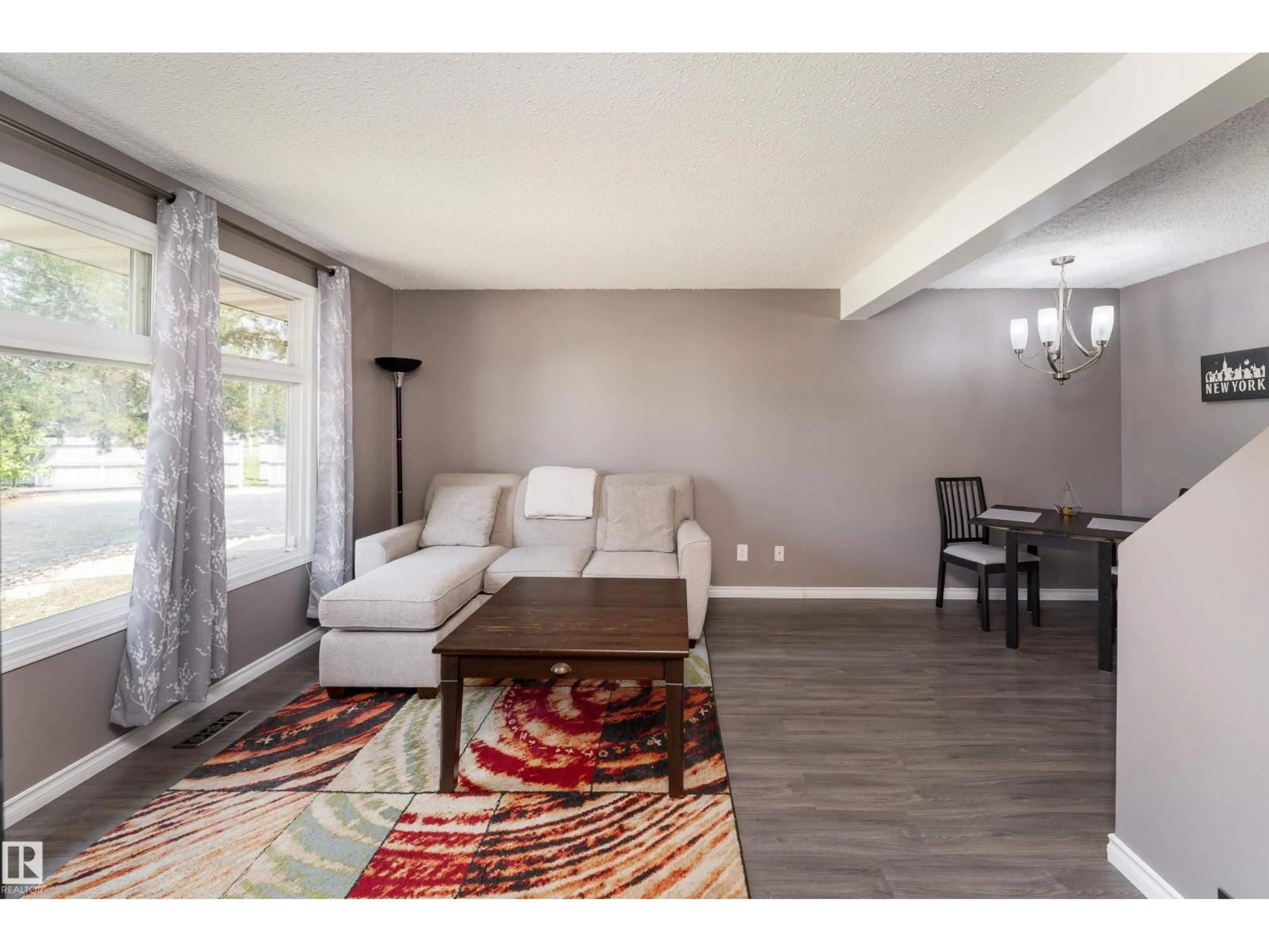 Living room with furniture, wood/laminate floor for 879 VILLAGE ME, Sherwood Park Alberta T8A4L9