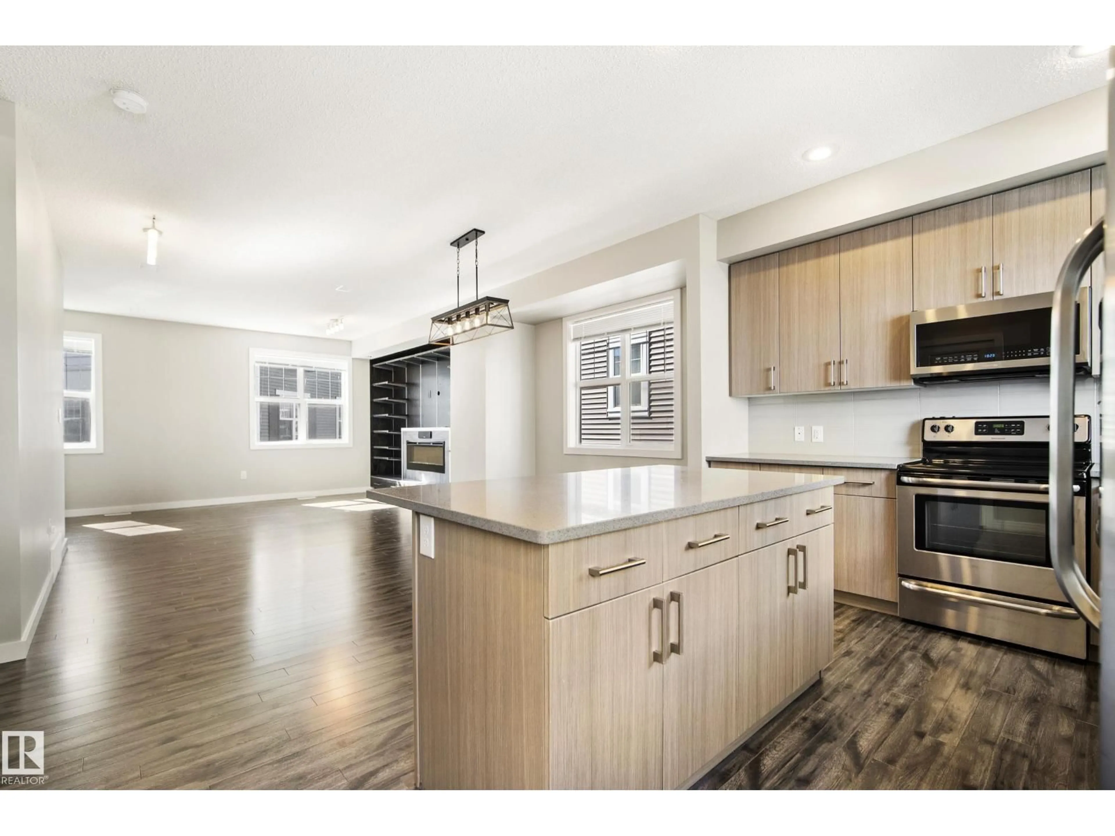 Open concept kitchen, wood/laminate floor for #82 - 2803 JAMES MOWATT TRAIL, Edmonton Alberta T6W2P5