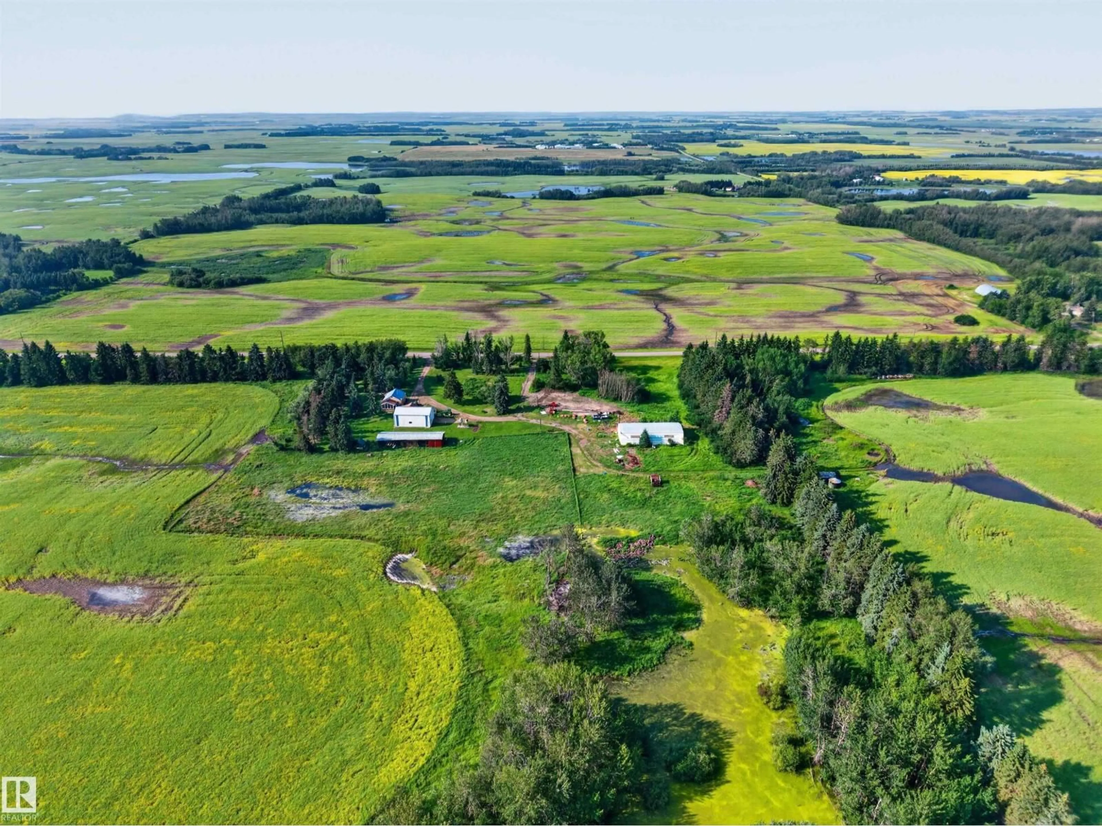 A pic from outside/outdoor area/front of a property/back of a property/a pic from drone, unknown for 21419 TWP 542, Rural Strathcona County Alberta T8L3Y8