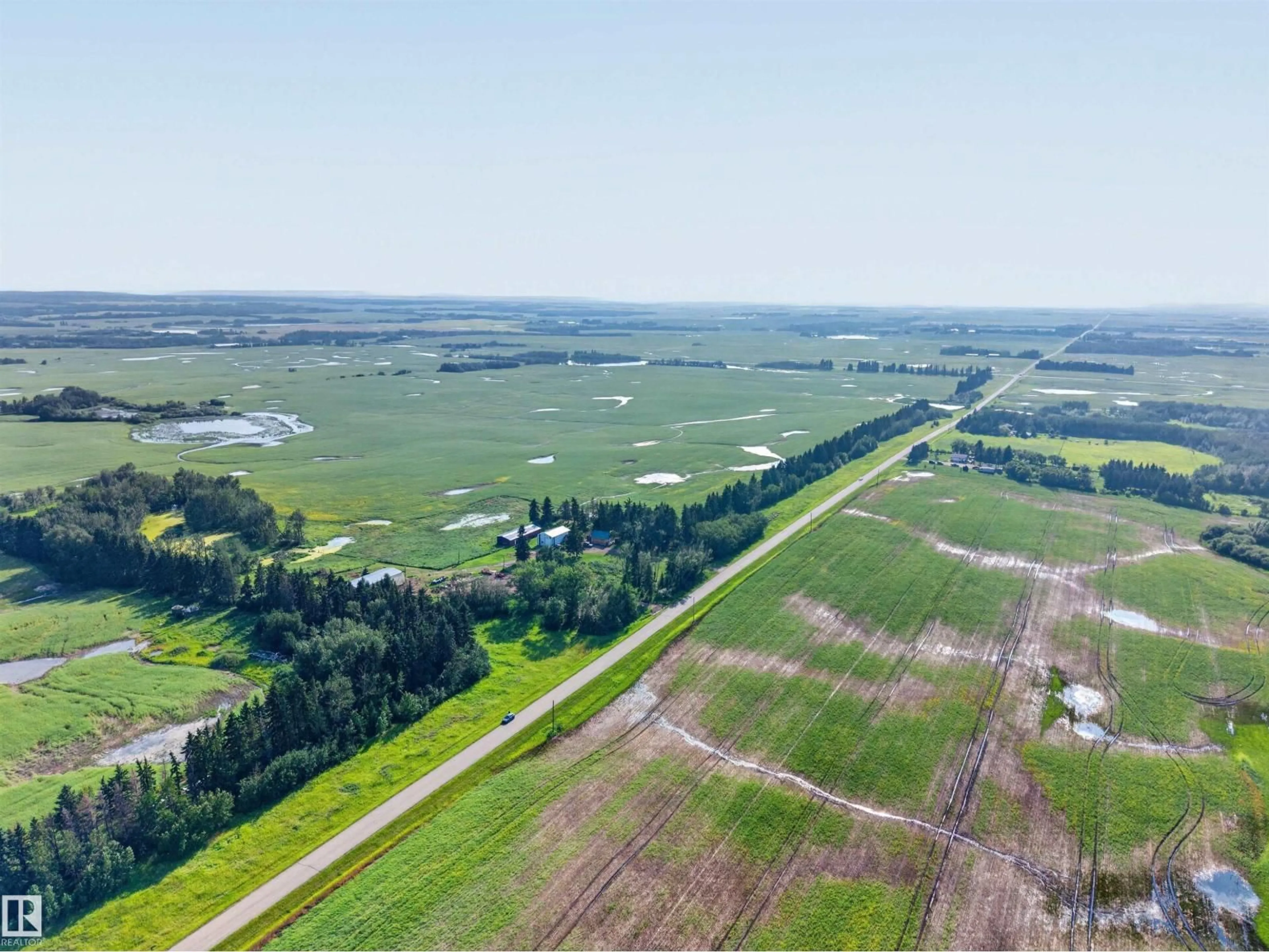 A pic from outside/outdoor area/front of a property/back of a property/a pic from drone, water/lake/river/ocean view for 21419 TWP 542, Rural Strathcona County Alberta T8L3Y8