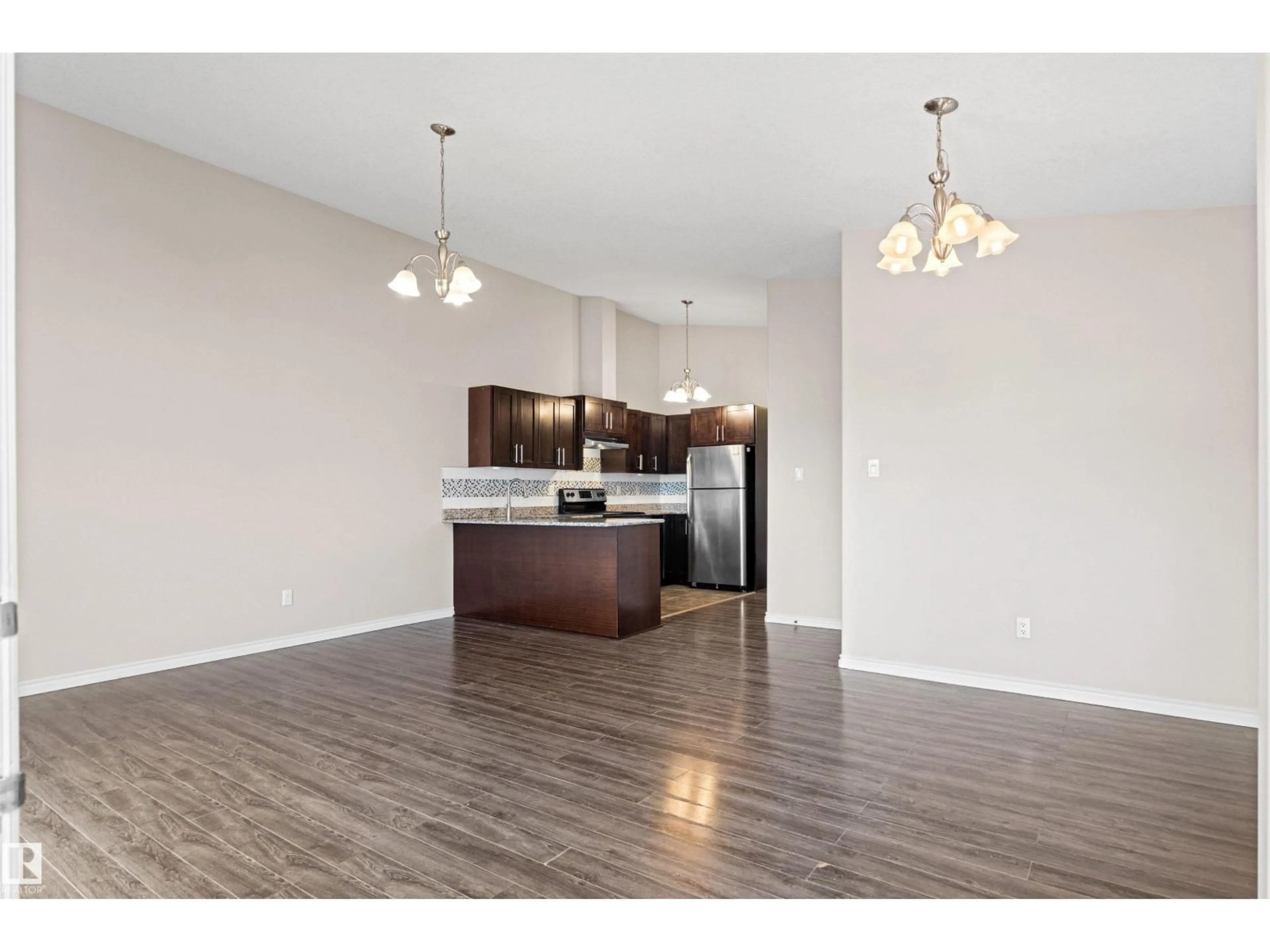 Open concept kitchen, wood/laminate floor for NW - 10634 155 ST, Edmonton Alberta T5P2M5