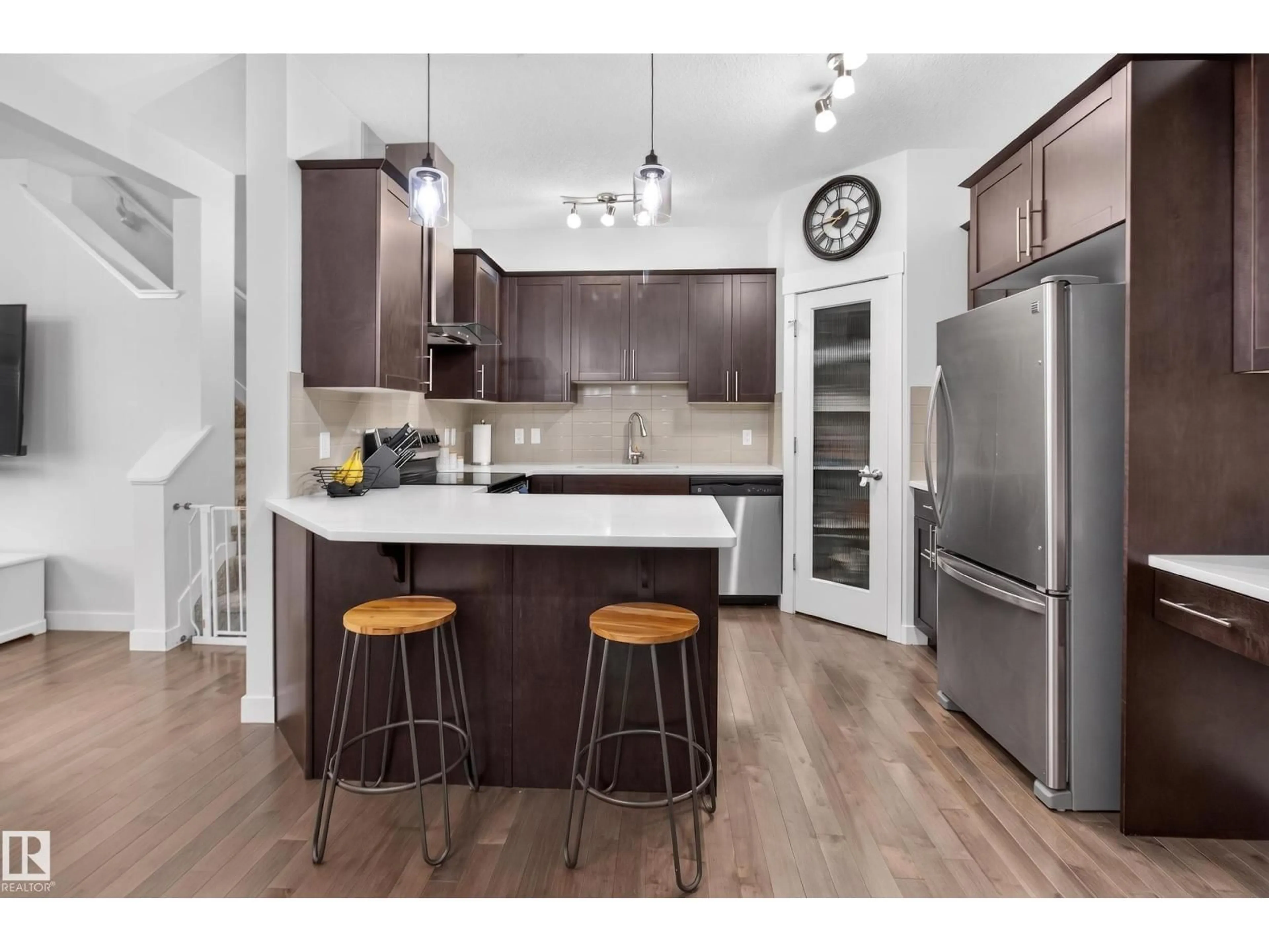 Open concept kitchen, wood/laminate floor for 17305 73 ST, Edmonton Alberta T5Z0L3