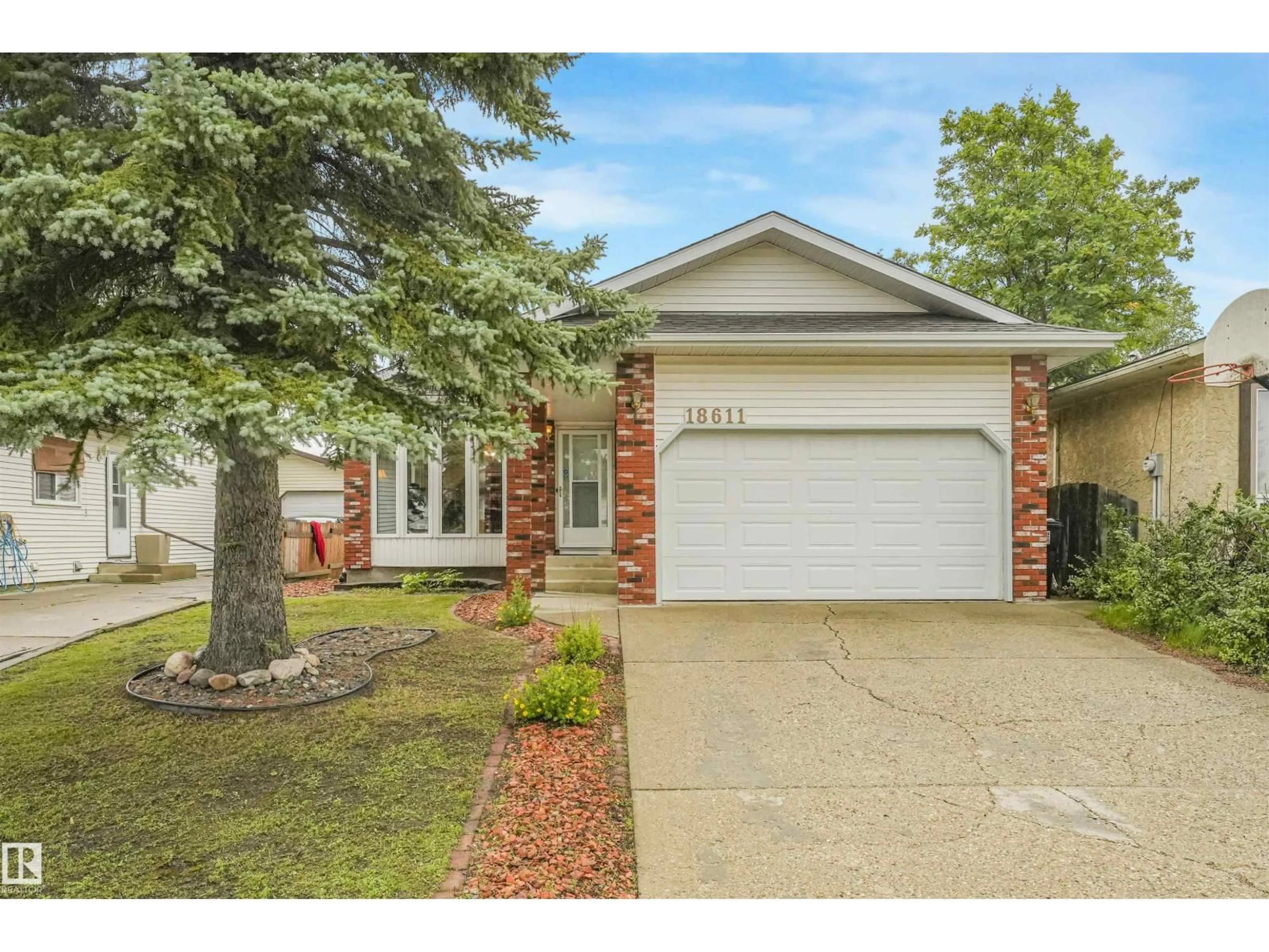Home with brick exterior material, street for 18611 57 AV, Edmonton Alberta T6M2A2