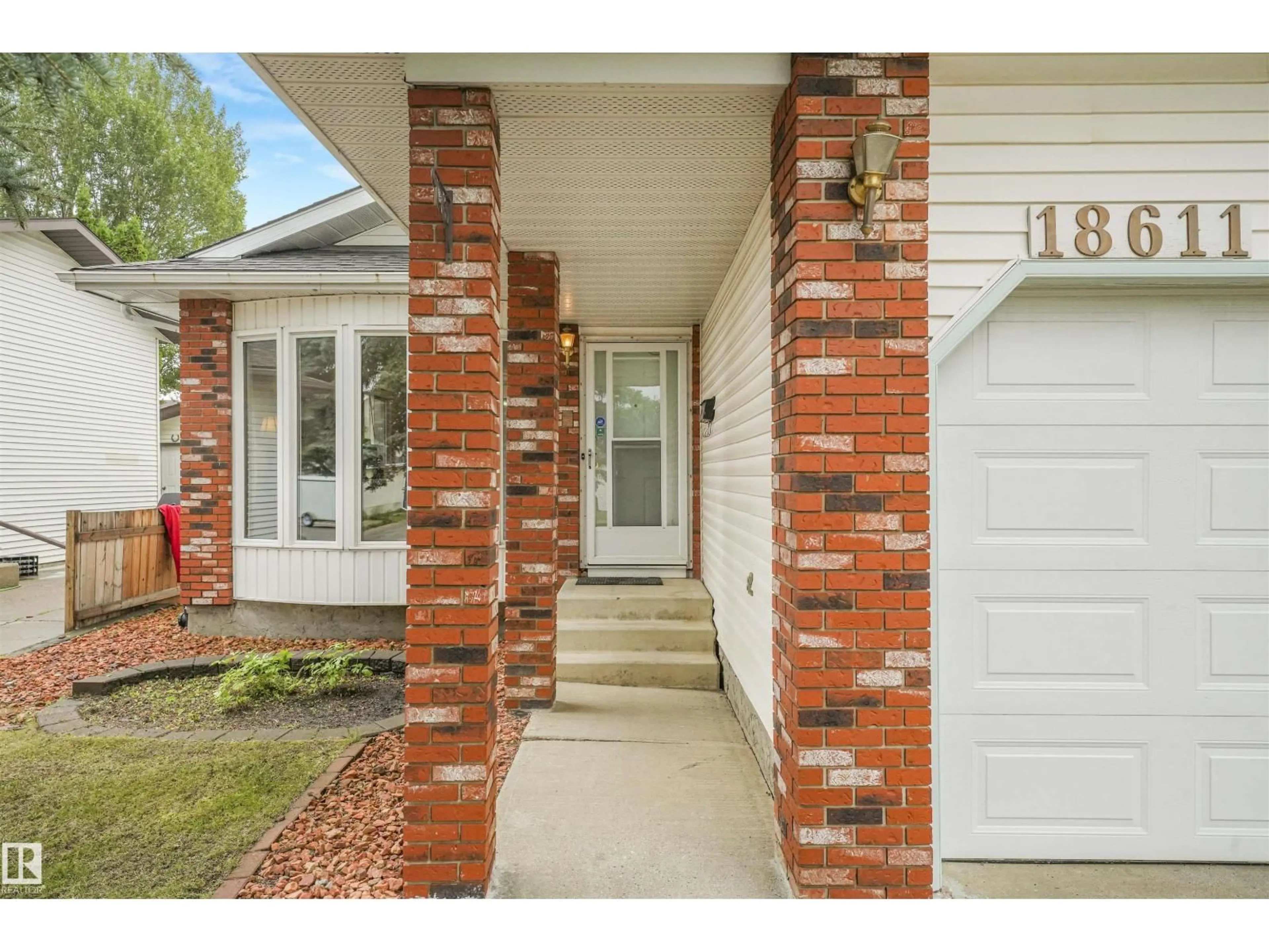 Home with brick exterior material, street for 18611 57 AV, Edmonton Alberta T6M2A2