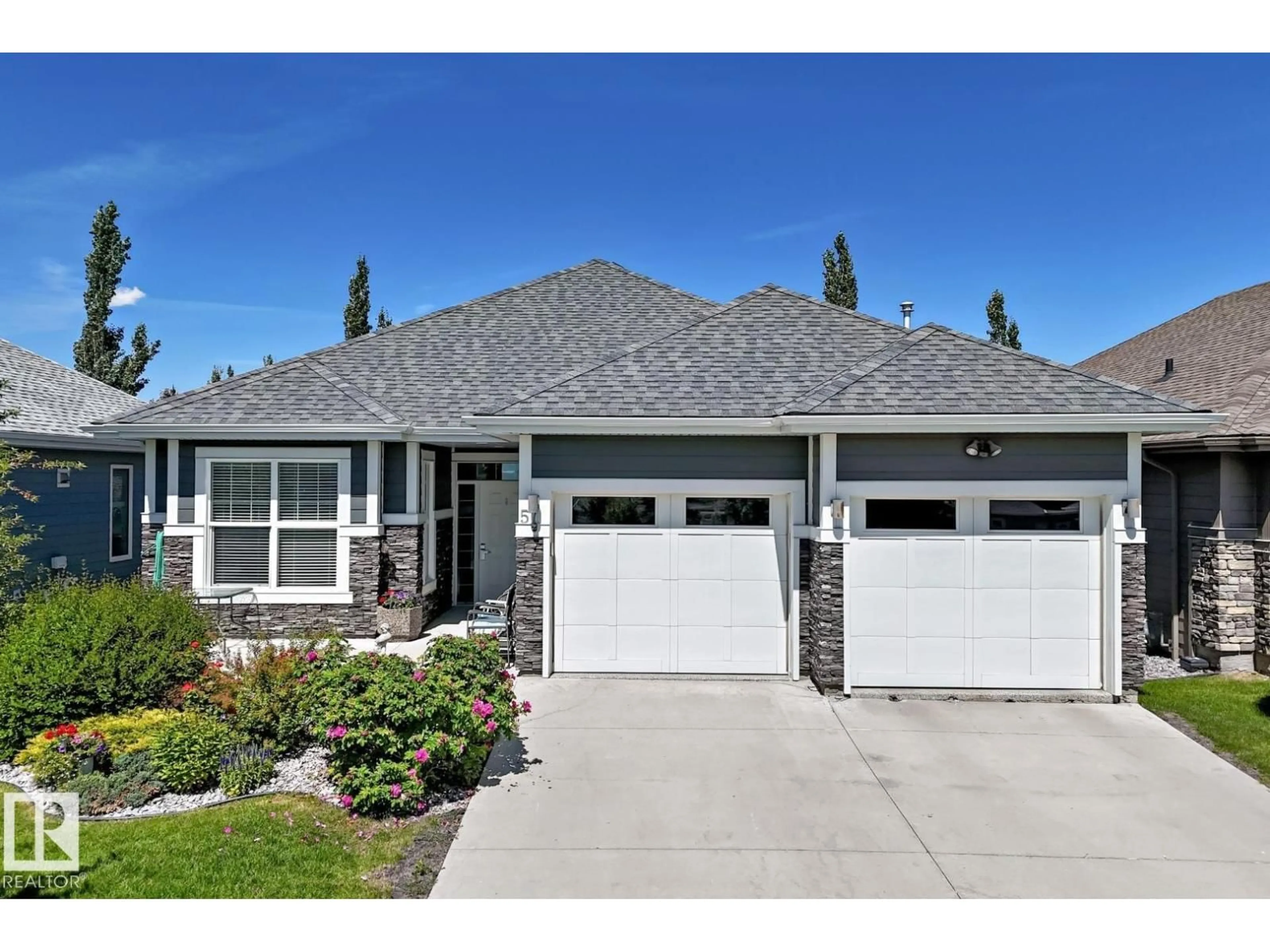 Home with vinyl exterior material, street for 18343 - 57 LESSARD RD, Edmonton Alberta T6A0A2