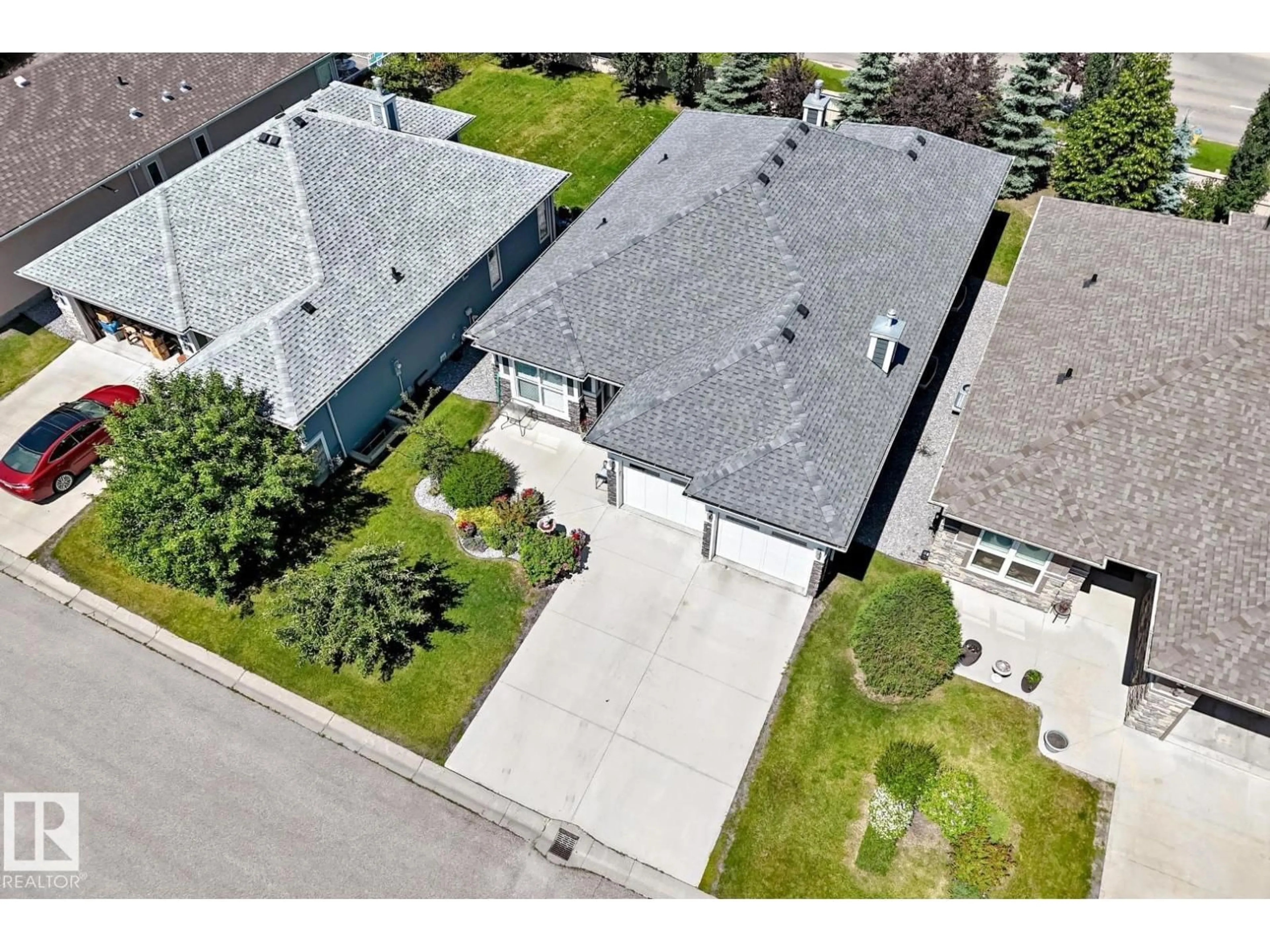 A pic from outside/outdoor area/front of a property/back of a property/a pic from drone, street for 18343 - 57 LESSARD RD, Edmonton Alberta T6A0A2