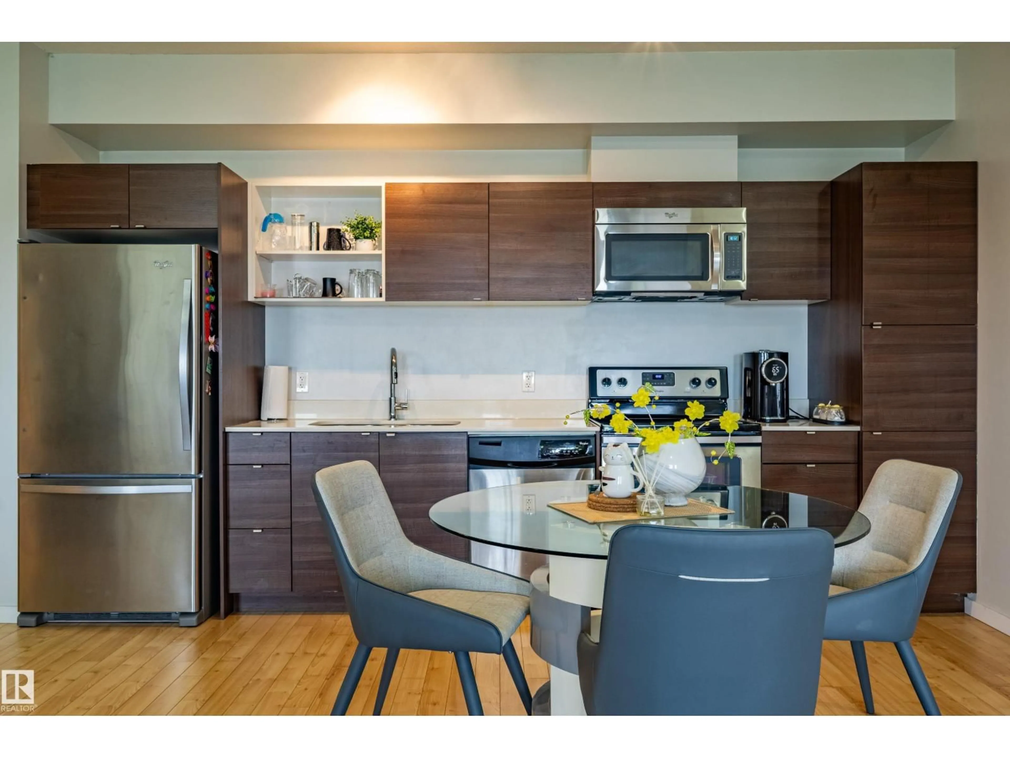 Open concept kitchen, wood/laminate floor for 407 - 9523 160 AV, Edmonton Alberta T5Z0N1