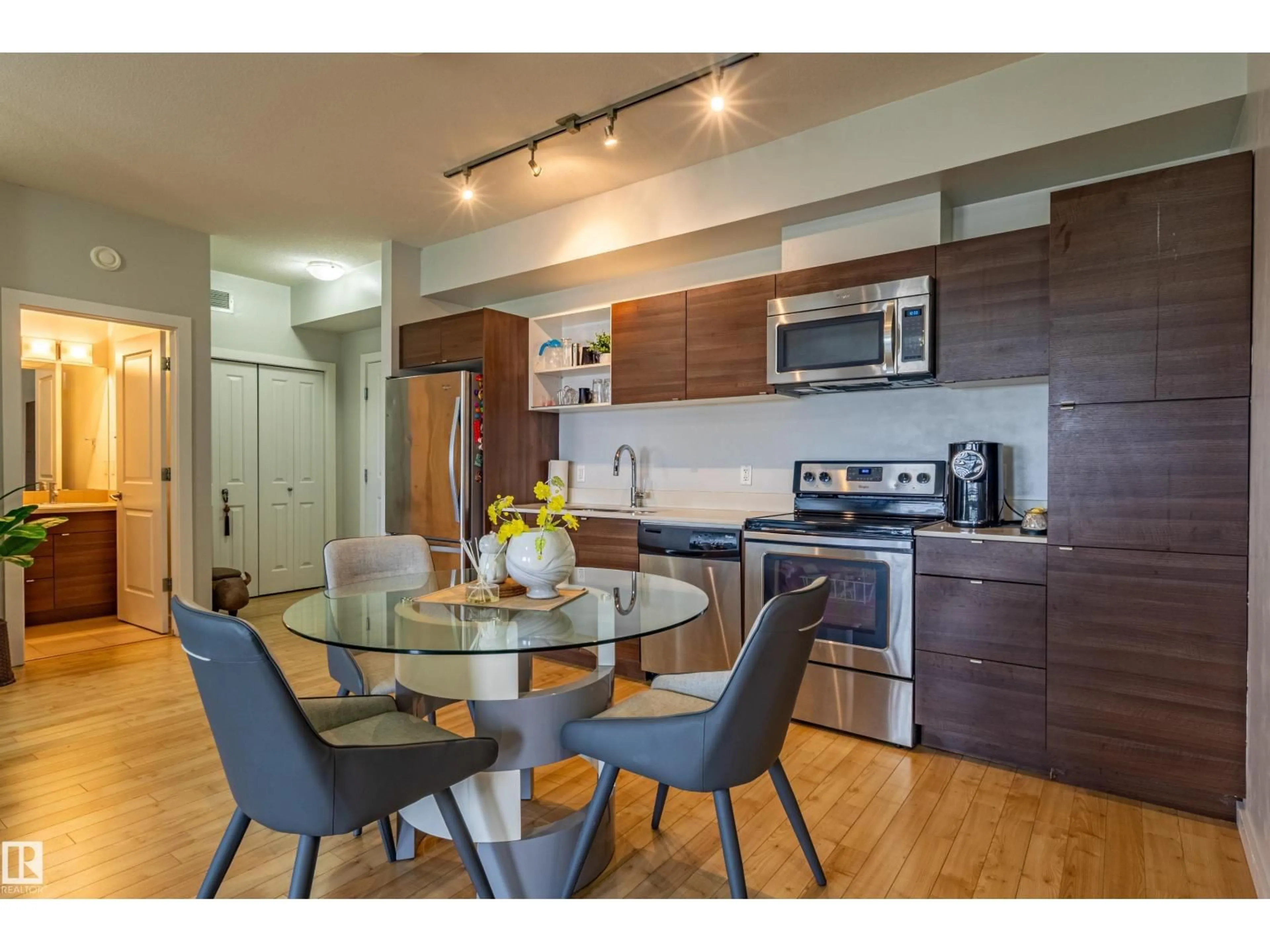 Open concept kitchen, wood/laminate floor for 407 - 9523 160 AV, Edmonton Alberta T5Z0N1