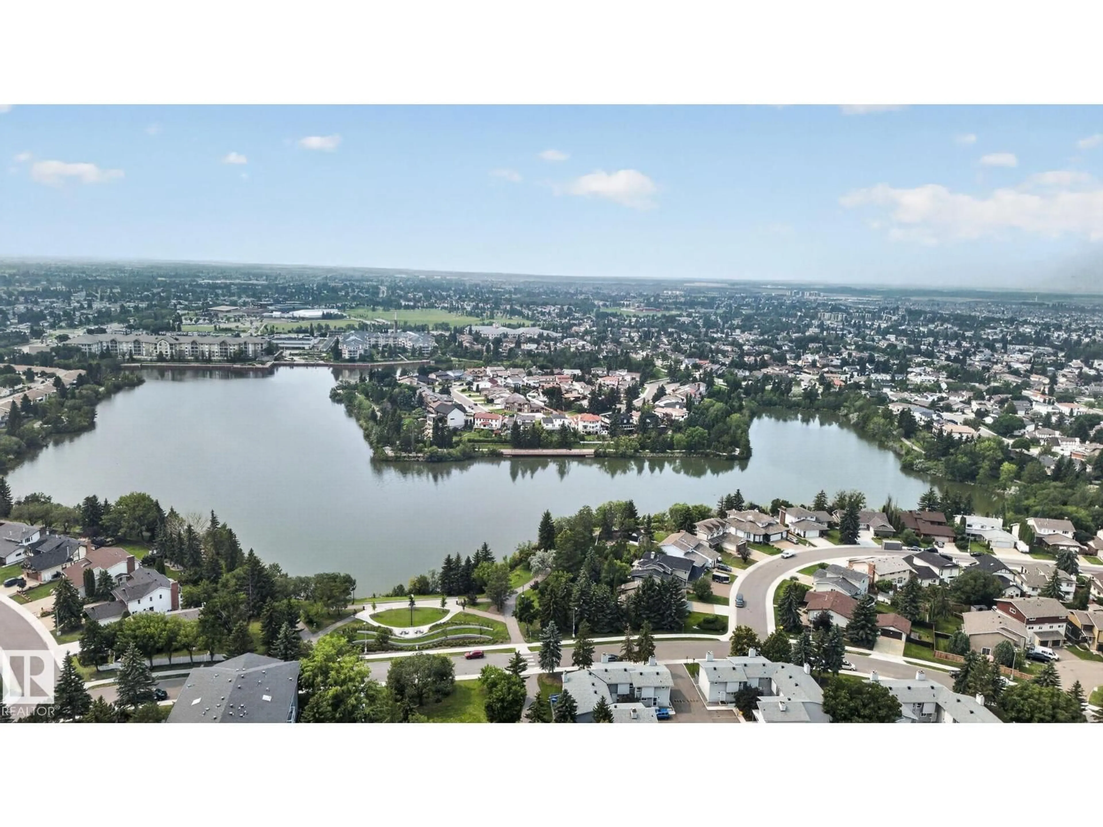 A pic from outside/outdoor area/front of a property/back of a property/a pic from drone, water/lake/river/ocean view for 10644 158 AV, Edmonton Alberta T5X4H5