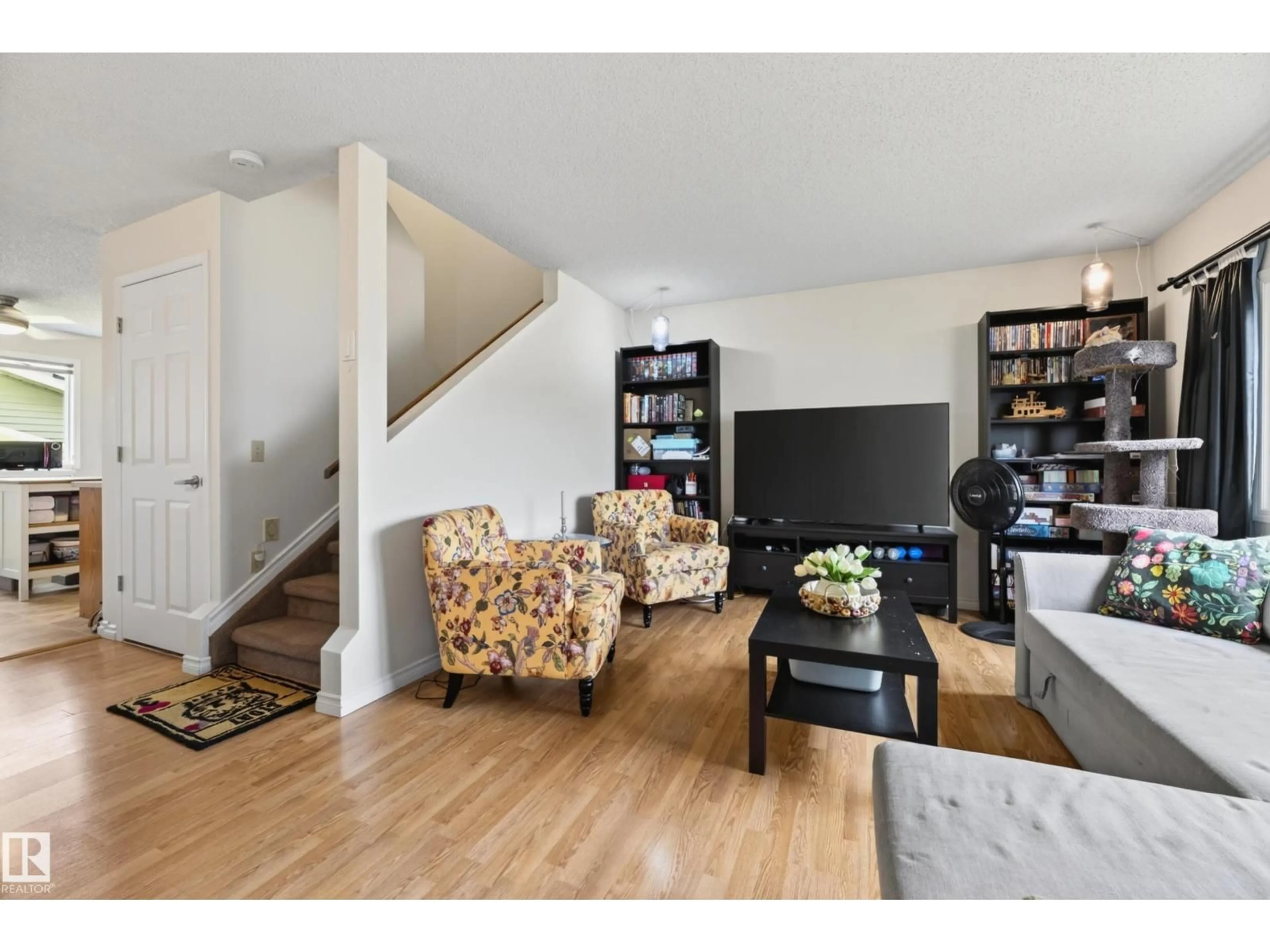 Living room with furniture, wood/laminate floor for 423 KIRKPATRICK CR, Edmonton Alberta T6L5C9