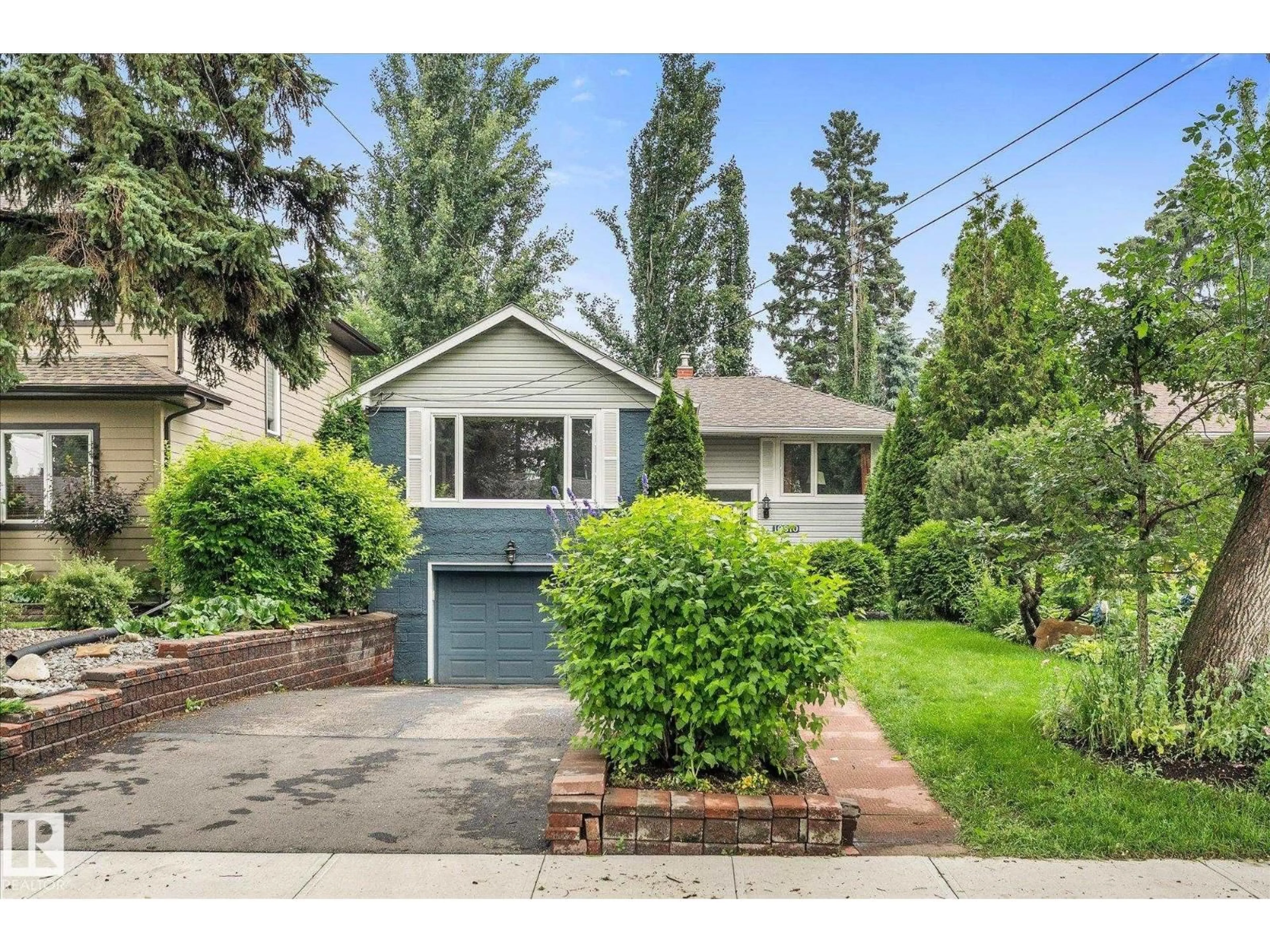 Home with vinyl exterior material, street for NW - 10810 54 AV, Edmonton Alberta T6H0T9