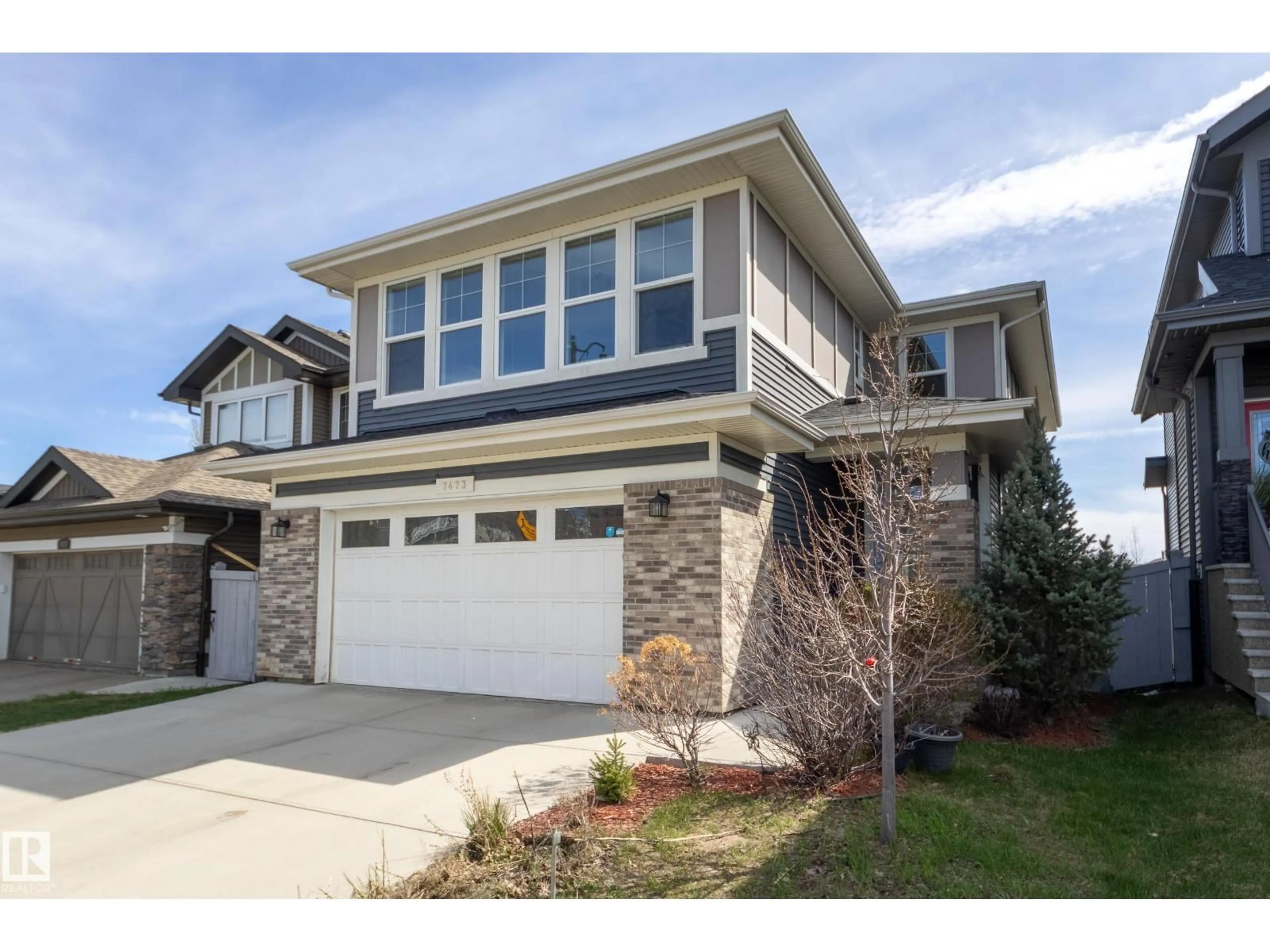 Home with vinyl exterior material, street for 7473 COLONEL MEWBURN RD, Edmonton Alberta T5E6V5