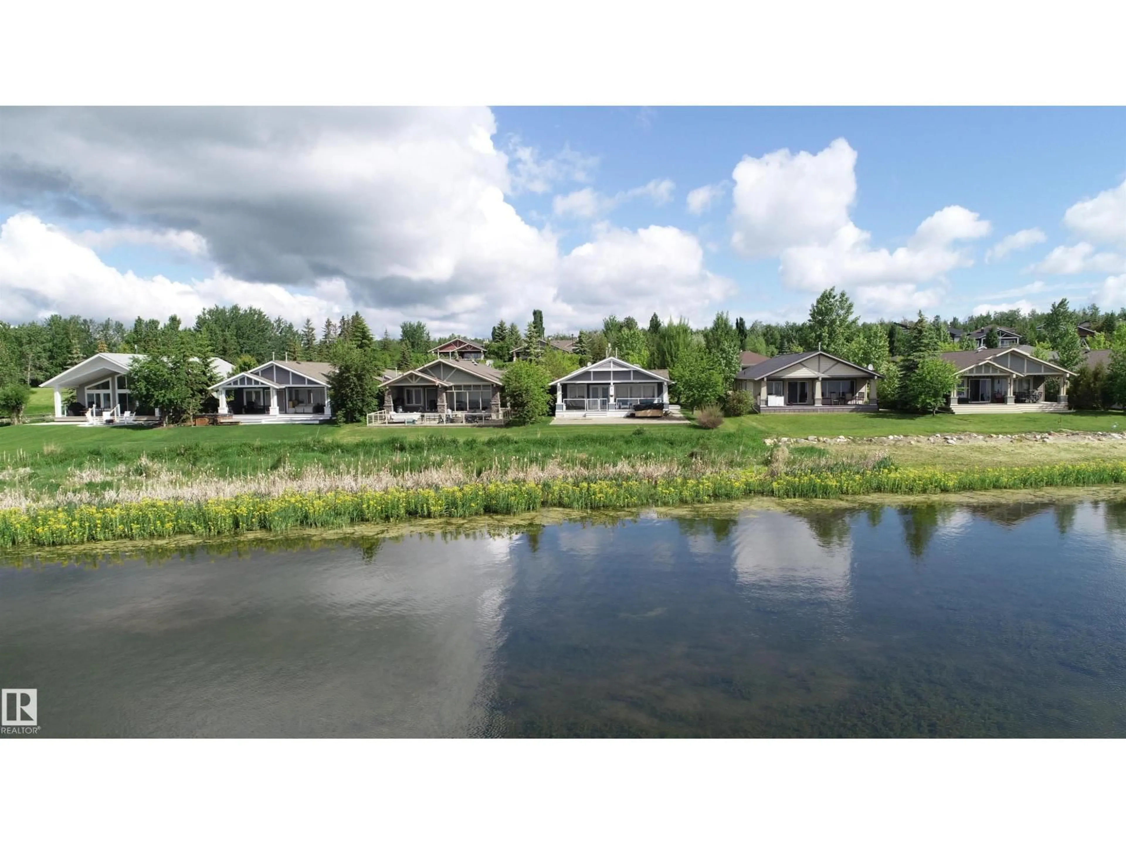 A pic from outside/outdoor area/front of a property/back of a property/a pic from drone, water/lake/river/ocean view for STE. 55101 - 71 ANNE TR, Rural Lac Ste. Anne County Alberta T0E1A1