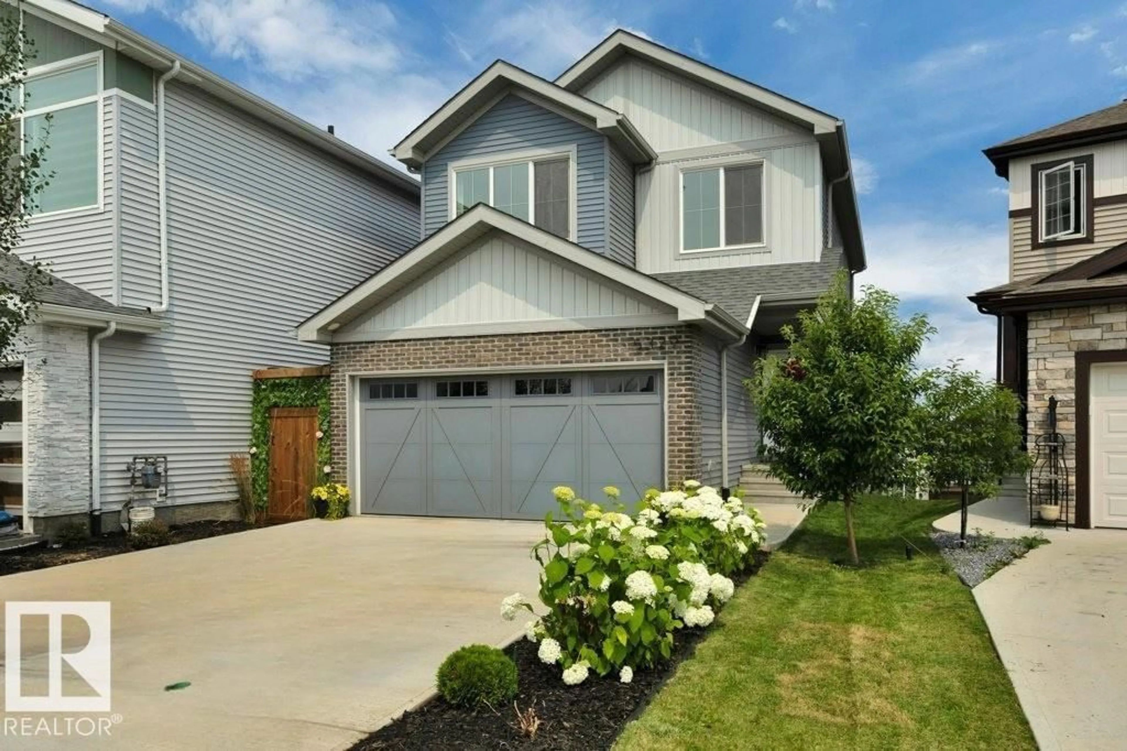 Home with vinyl exterior material, street for 5329 LARK LD, Edmonton Alberta T5S0P2
