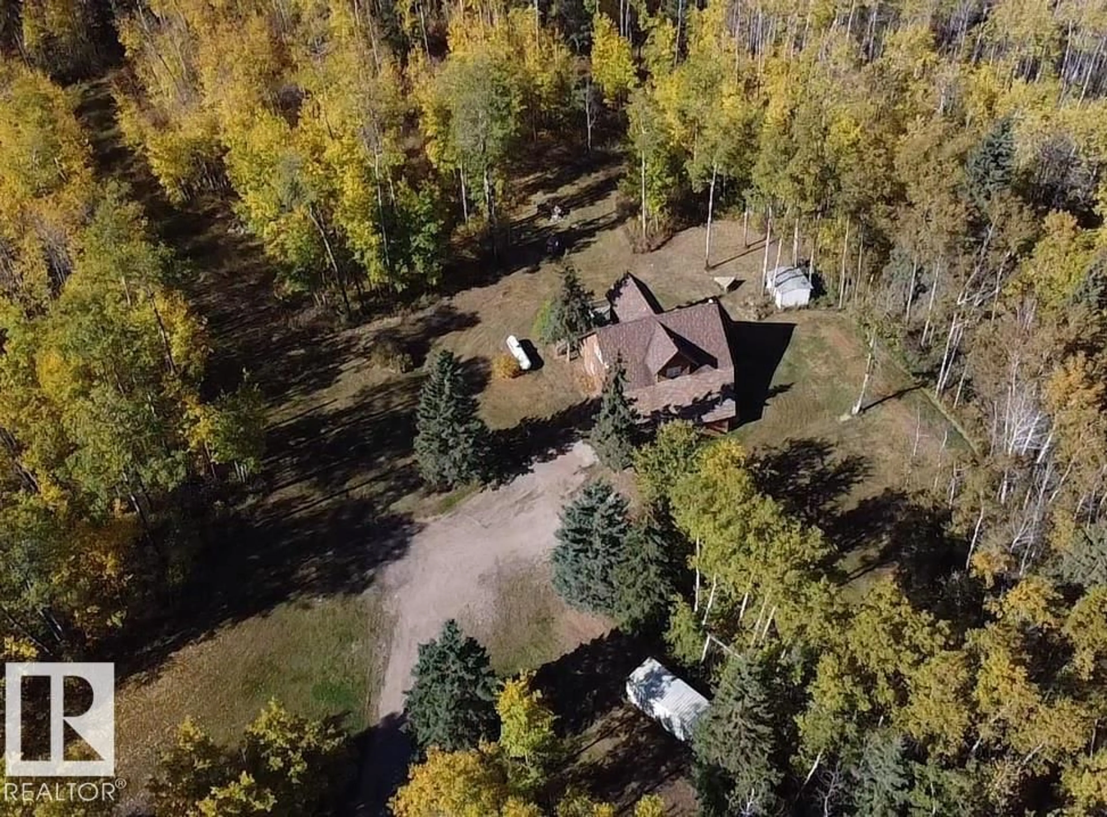 A pic from outside/outdoor area/front of a property/back of a property/a pic from drone, forest/trees view for 63106 RGE RD 471, Rural Bonnyville M.D. Alberta T9N2J6
