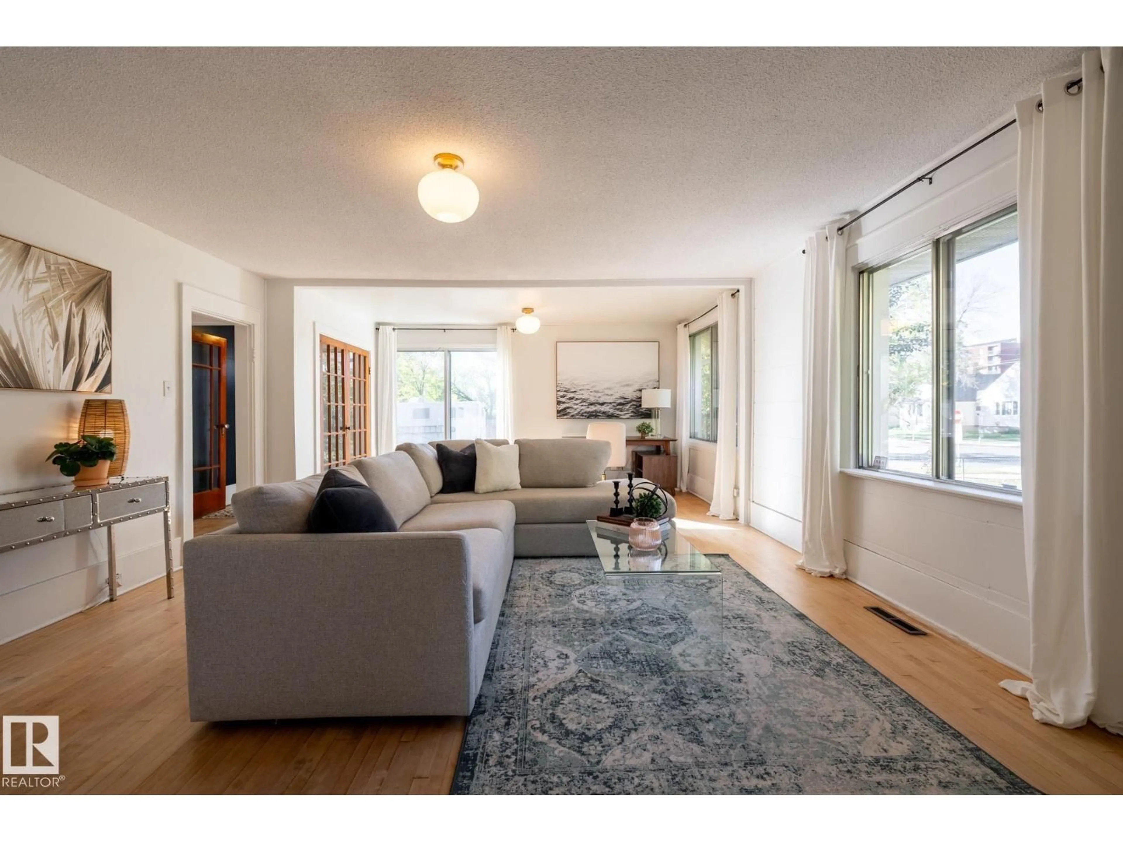 Living room with furniture, unknown for 12628 112 AV, Edmonton Alberta T5M2T3