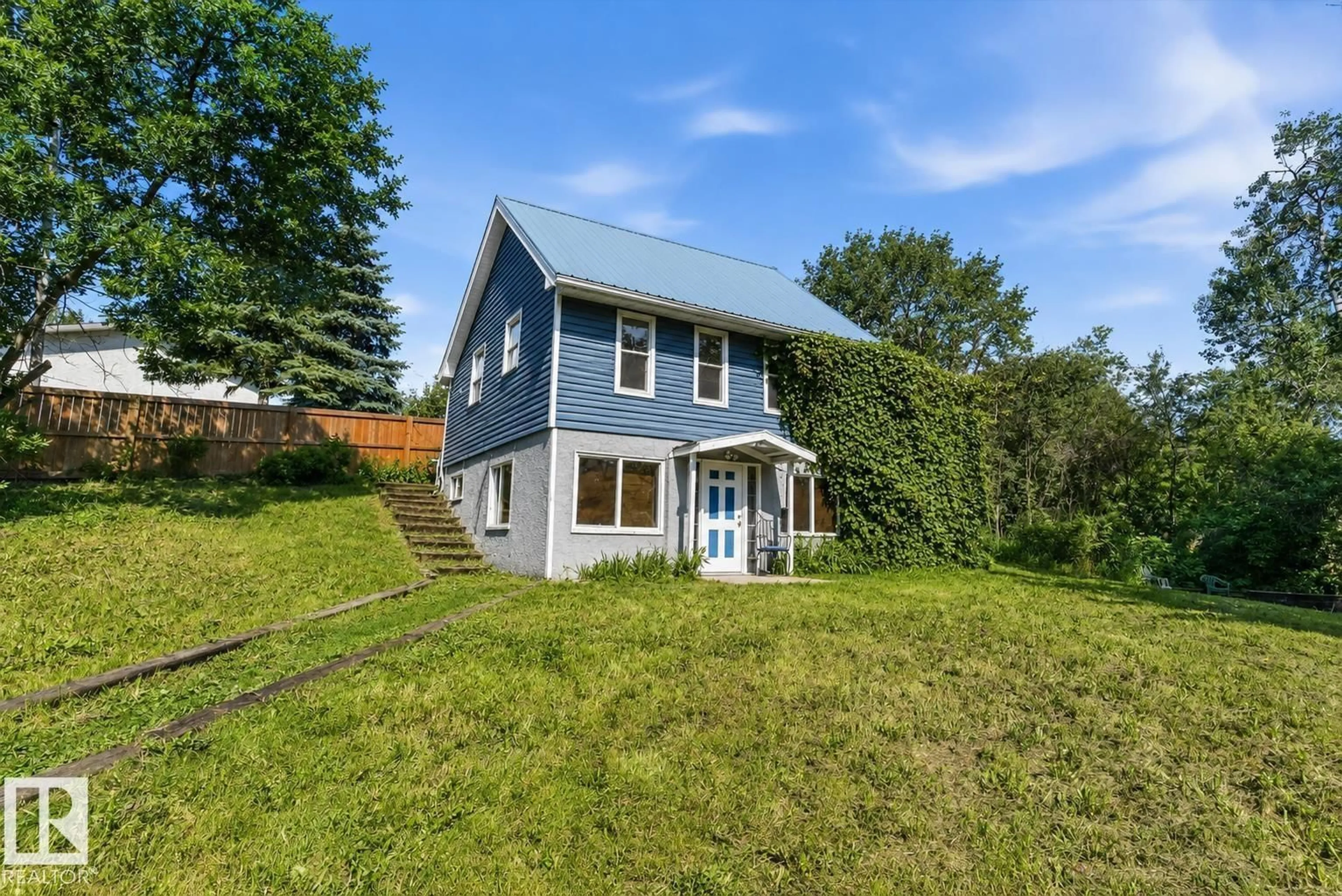 A pic from outside/outdoor area/front of a property/back of a property/a pic from drone, water/lake/river/ocean view for #204 - 22106 S COOKING LAKE RD, Rural Strathcona County Alberta T8E1J1