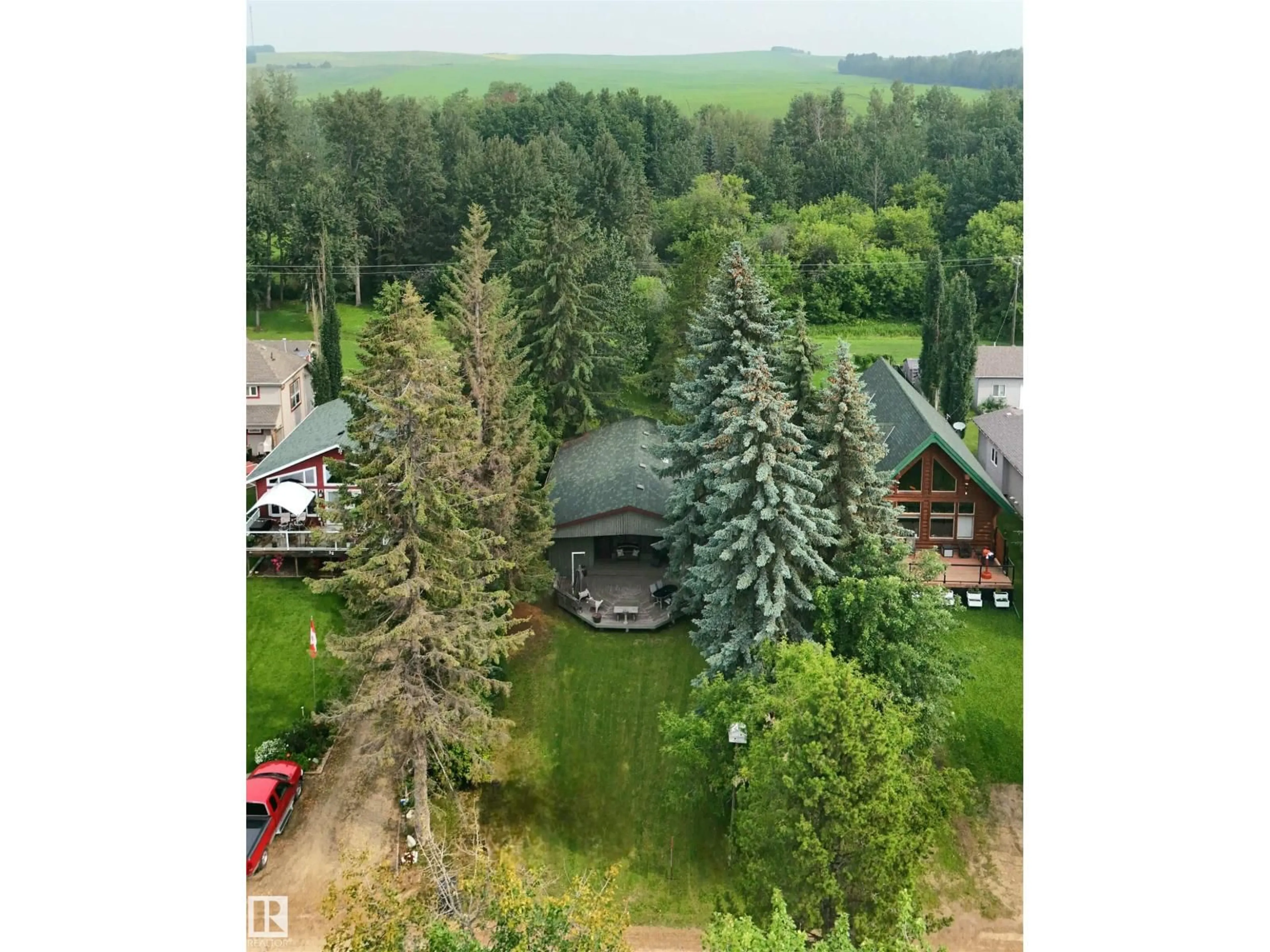 A pic from outside/outdoor area/front of a property/back of a property/a pic from drone, forest/trees view for 39 SUNDANCE BE, Rural Leduc County Alberta T0C2P0