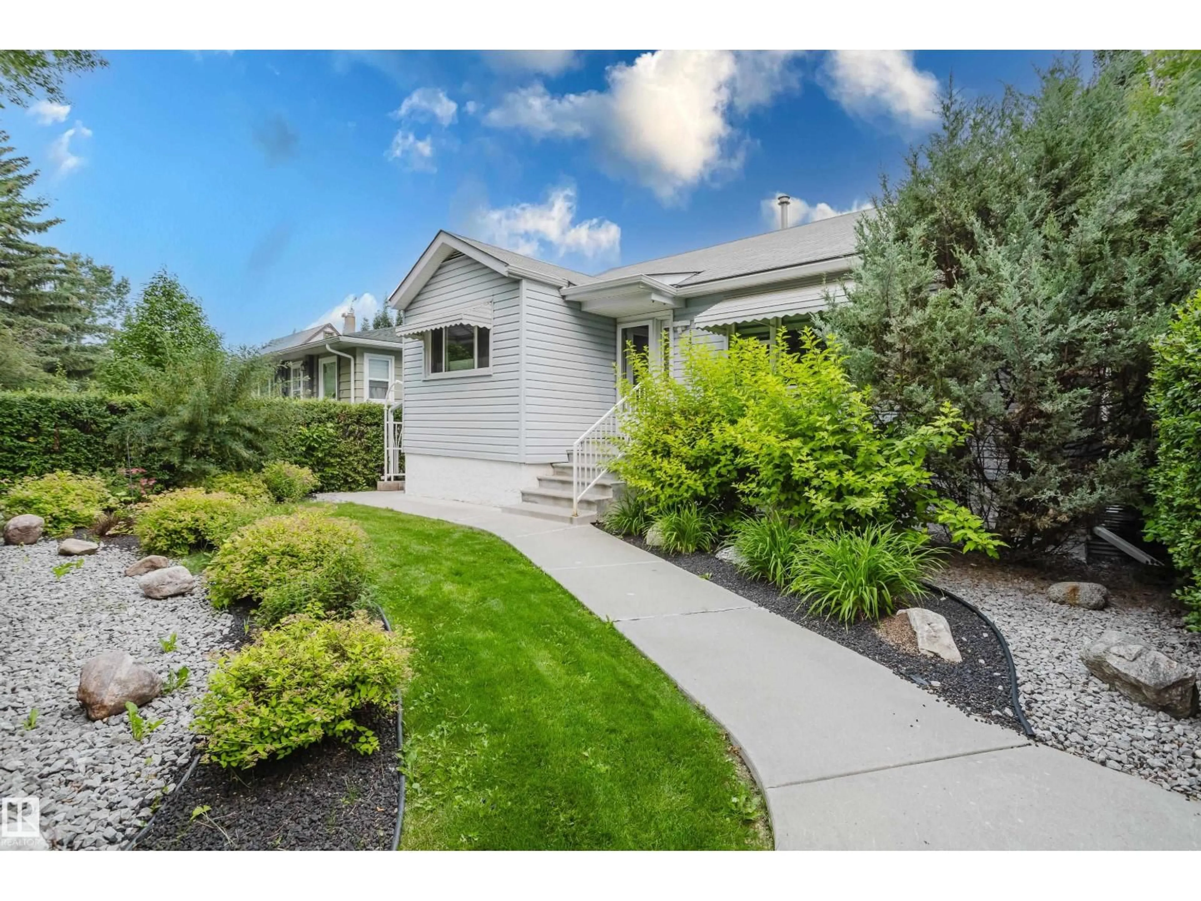 Home with vinyl exterior material, street for NW - 14814 104 AV, Edmonton Alberta T5N0X7