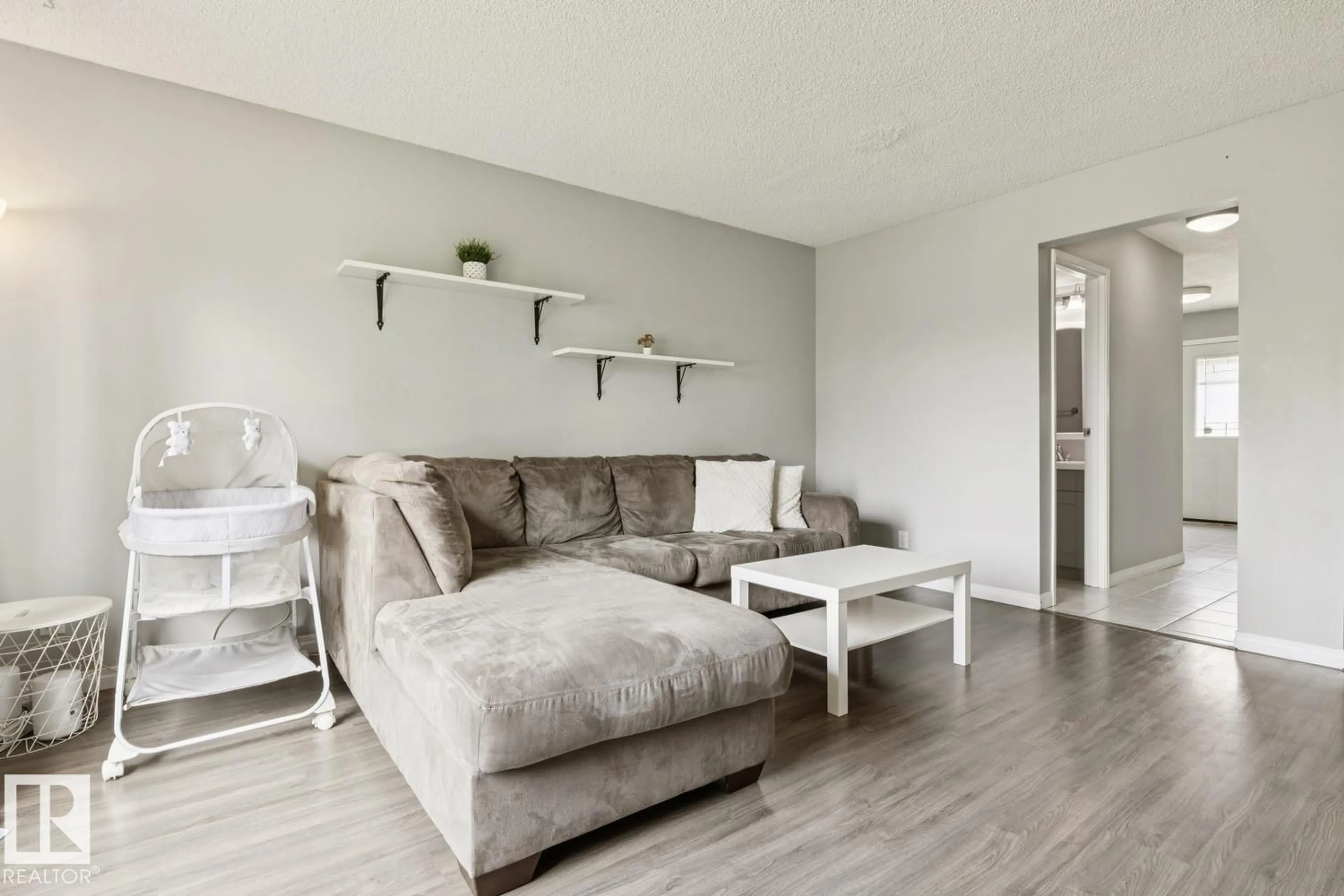 Living room with furniture, wood/laminate floor for 11421 22 AV, Edmonton Alberta T6J4V8