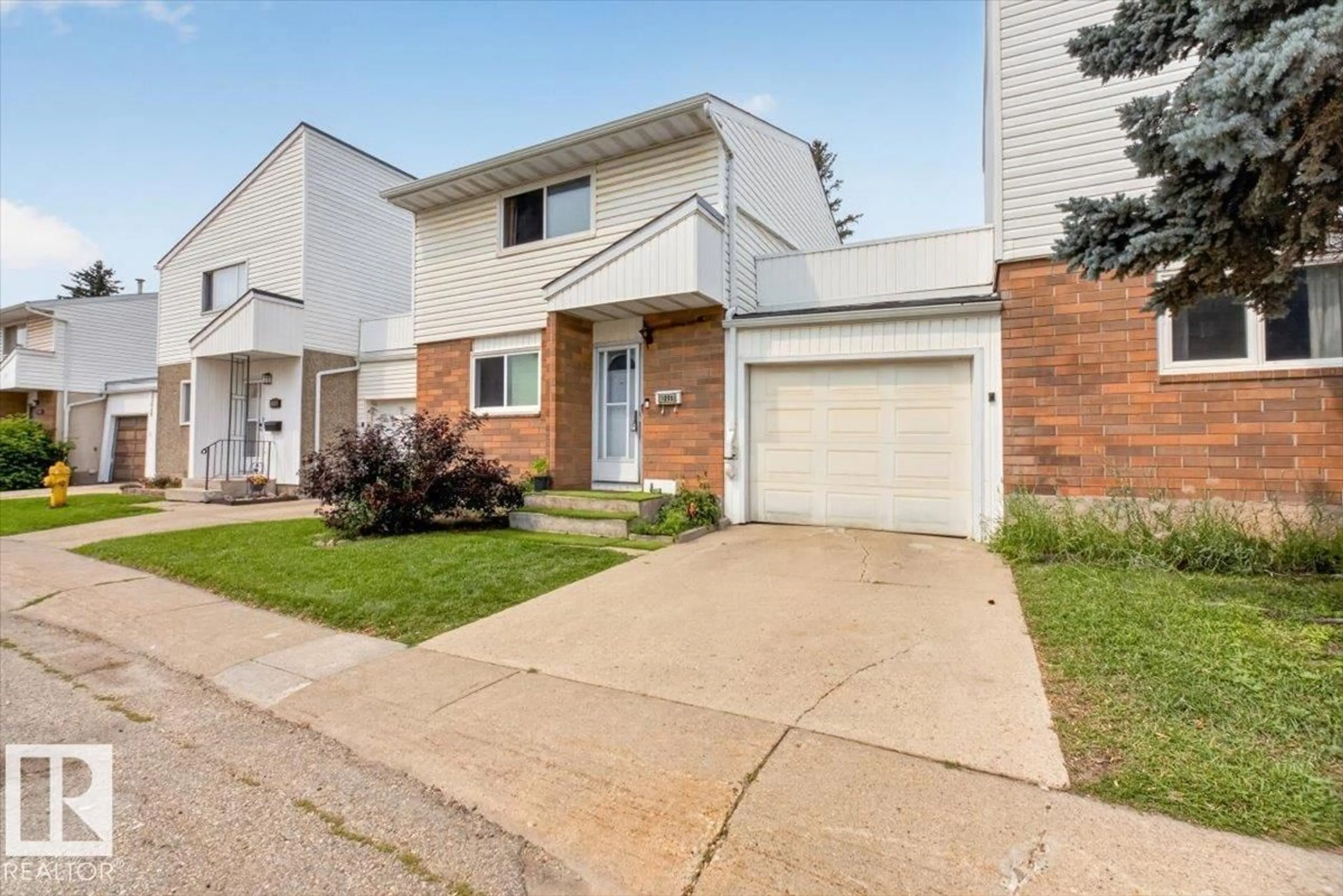 Home with brick exterior material, street for 1096 MILLBOURNE RD E NW, Edmonton Alberta T6K1W1