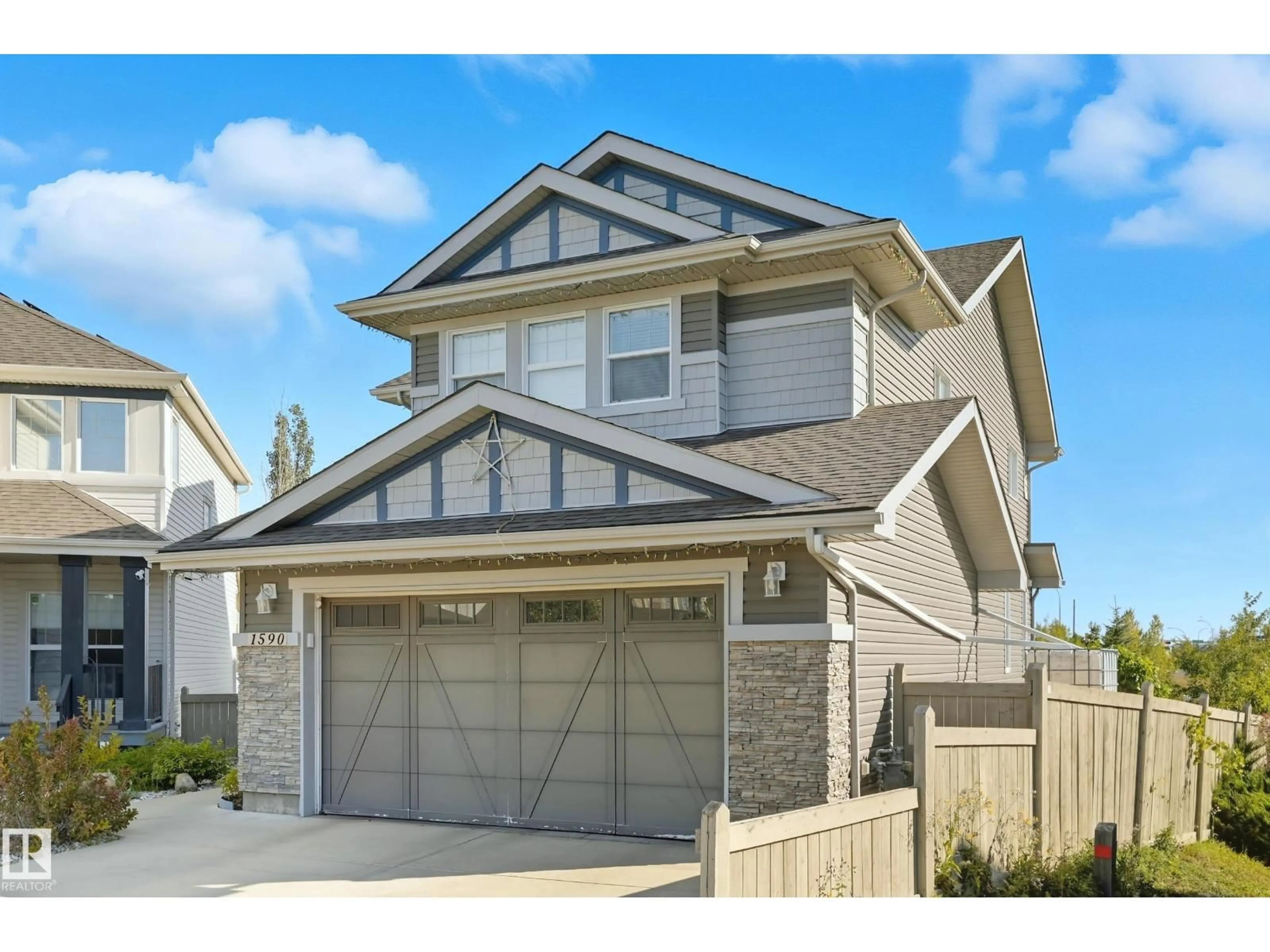 Home with vinyl exterior material, street for SW - 1590 CHAPMAN WY, Edmonton Alberta T6W0Z2