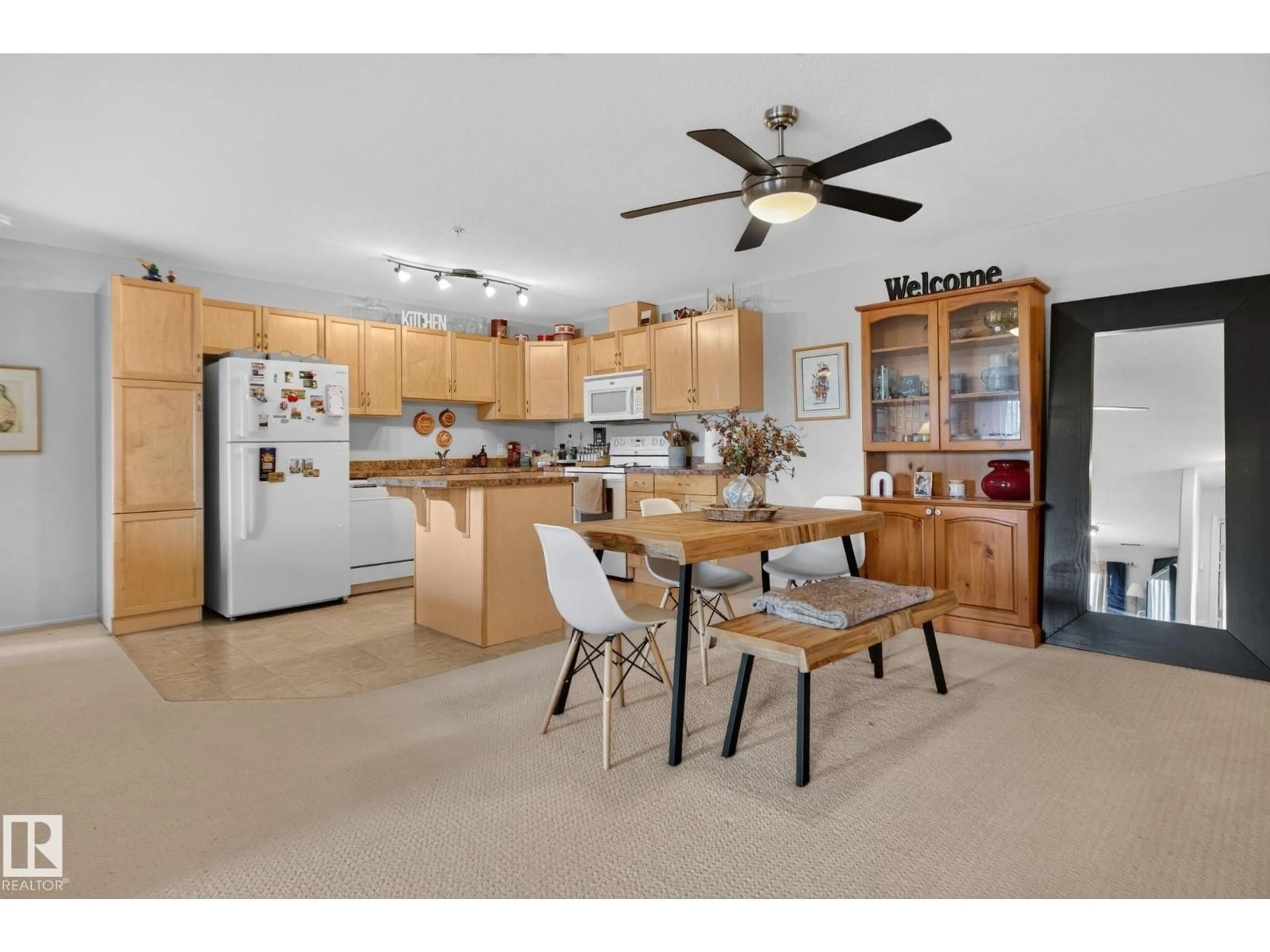 Open concept kitchen, wood/laminate floor for #335 - 2096 BLACKMUD CREEK DR, Edmonton Alberta T6W0G1