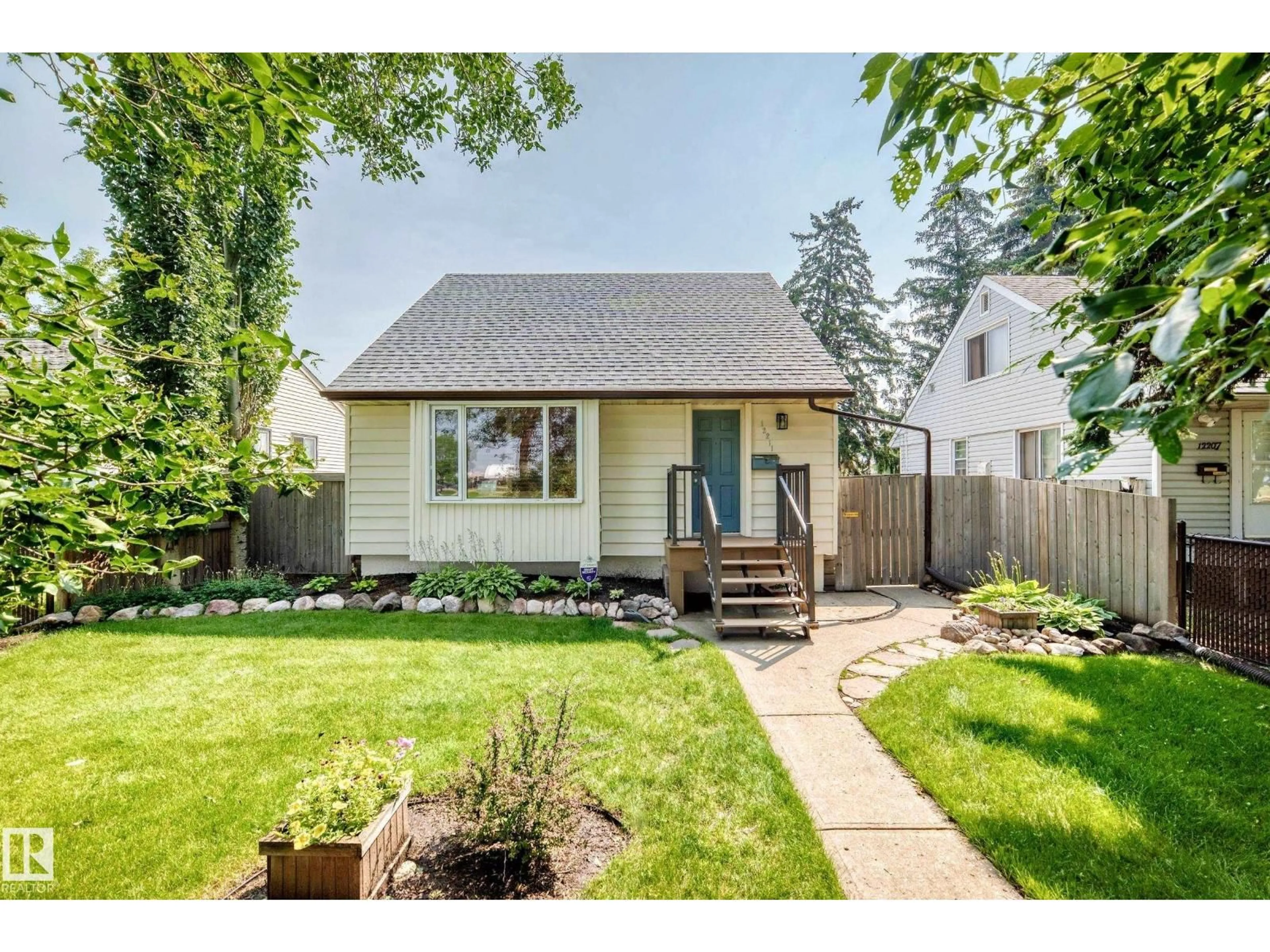 Home with vinyl exterior material, street for NW - 12211 107 ST, Edmonton Alberta T5G2S9